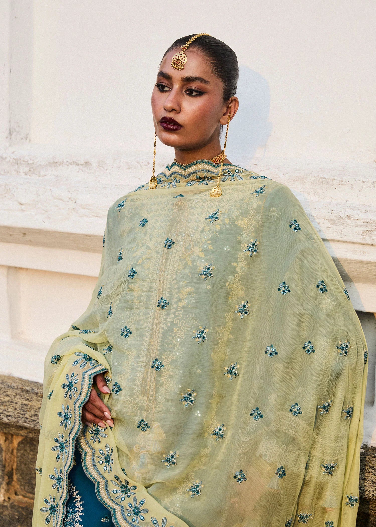 Model wearing Hussain Rehar Luxury Lawn '25 Eupic in teal blue with intricate embroidery. Shop Pakistani luxury pret online in the UK.