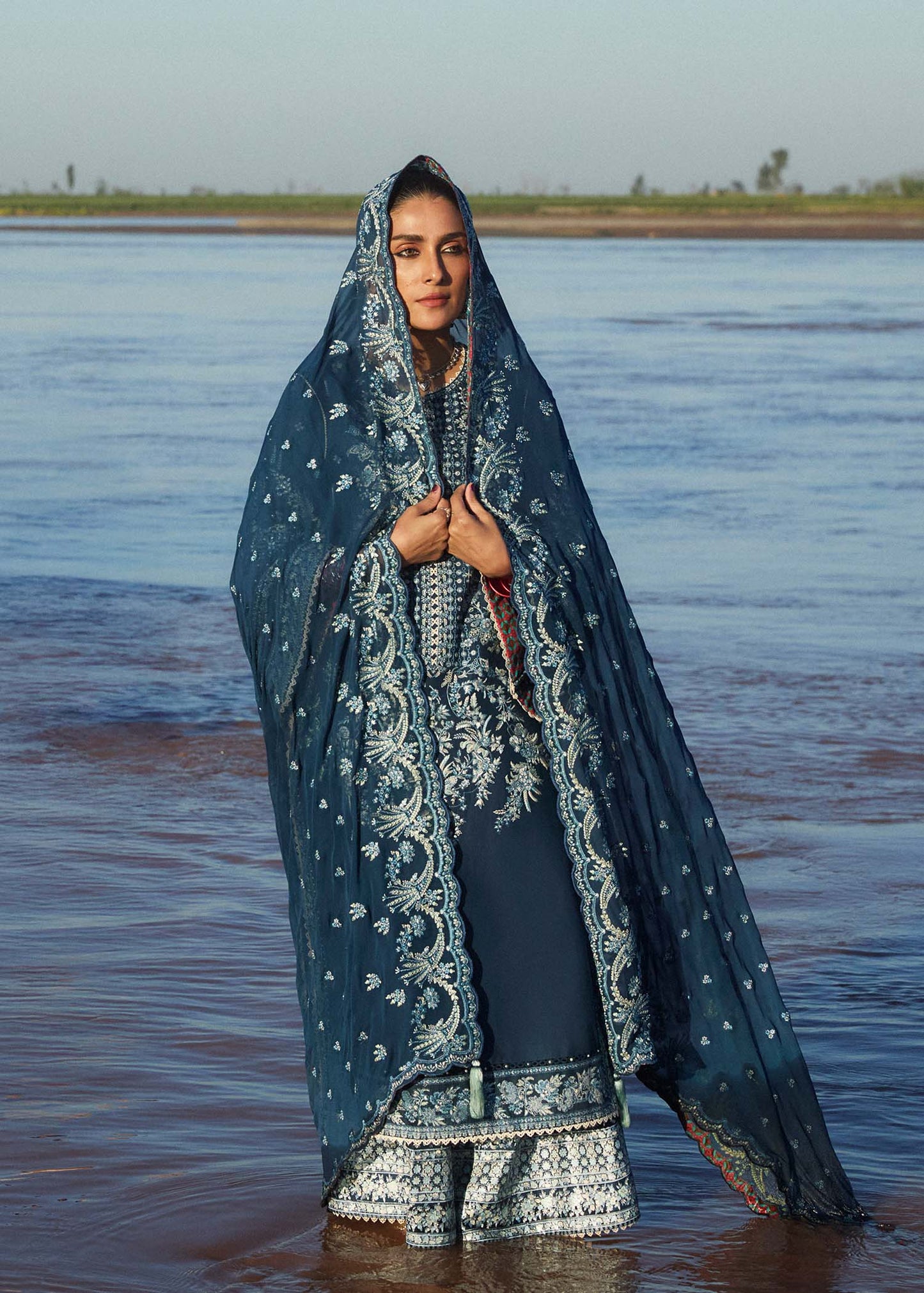Model wearing navy blue dress Meherbano by Hussain Rehar, Pakistani luxury pret online in UK.