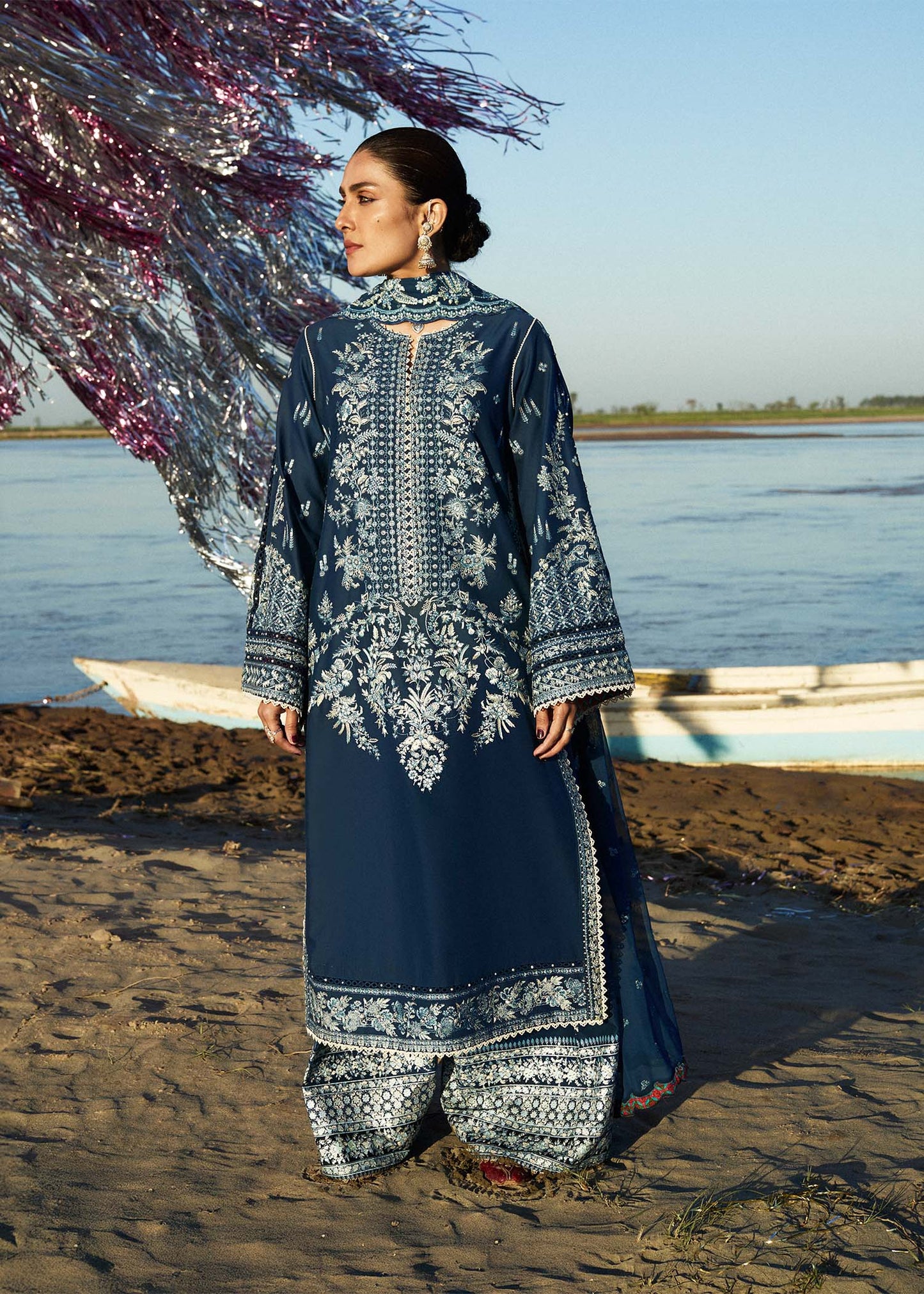 Model wearing navy blue dress Meherbano by Hussain Rehar, Pakistani luxury pret online in UK.