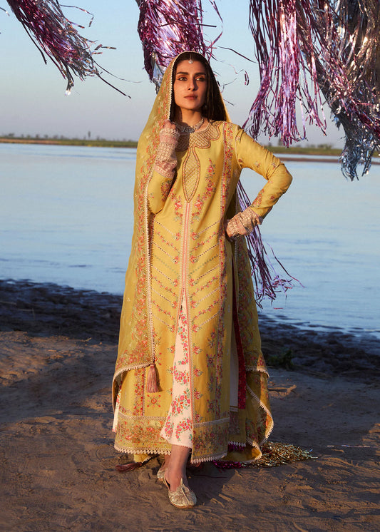 Model wearing mustard and ivory Soana dress from Hussain Rehar, showcasing Pakistani luxury pret and Pakistani clothes online in UK.