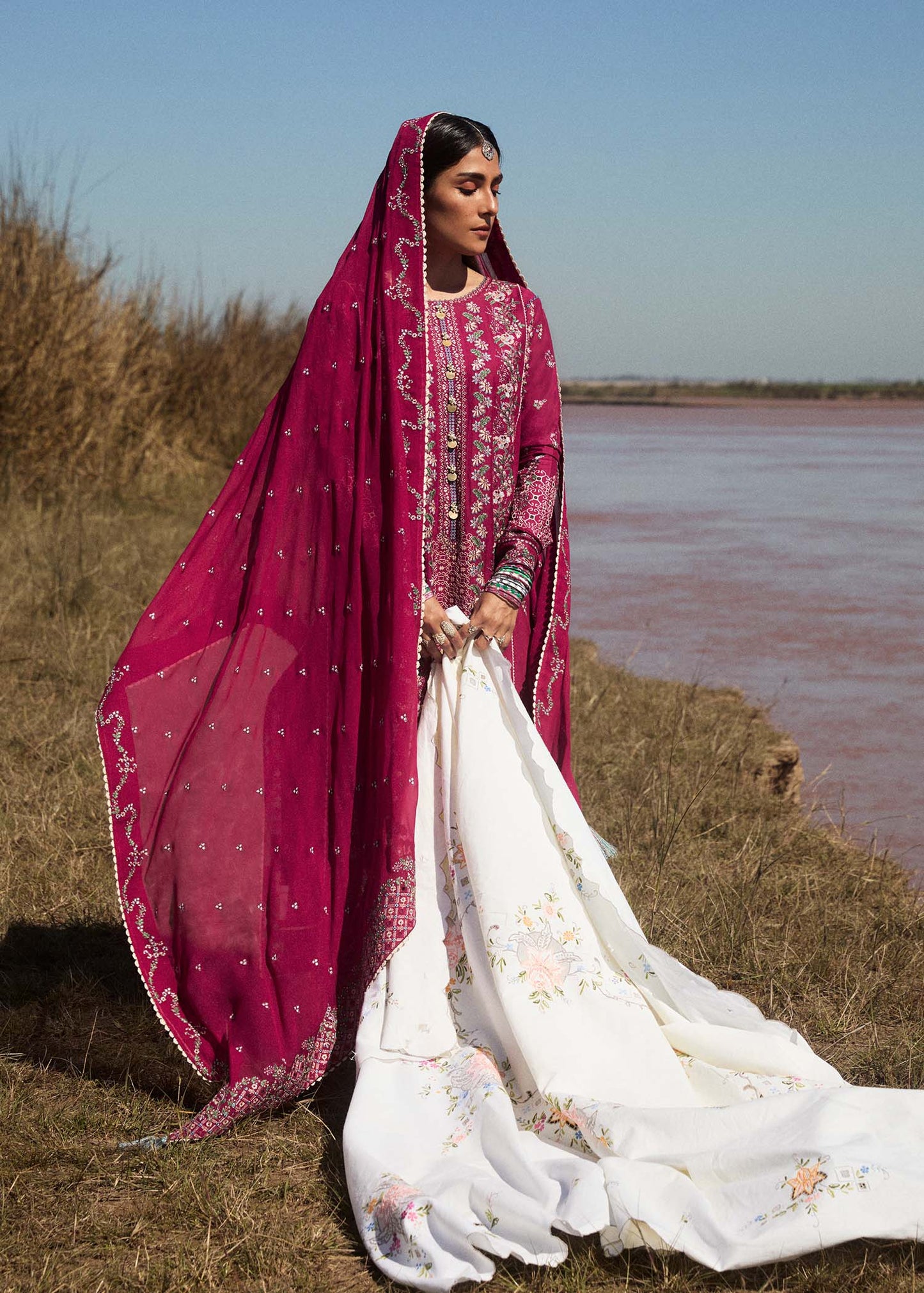 Model wearing deep pink embroidered dress Mehrunisa by Hussain Rehar, Pakistani luxury pret online in UK.