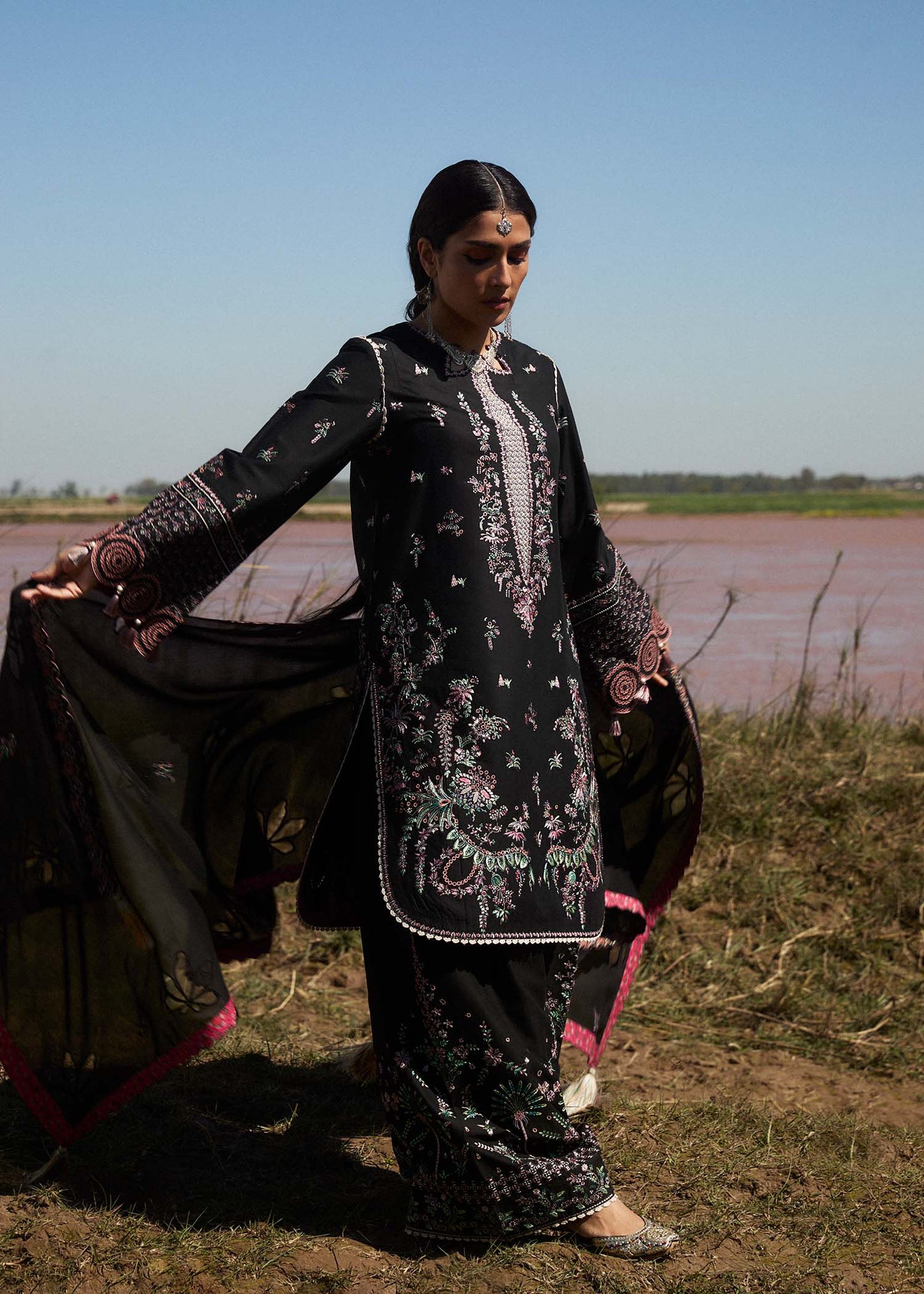 Model wearing black dress Siyah by Hussain Rehar, Pakistani luxury pret online in UK for festive wear and Eid.