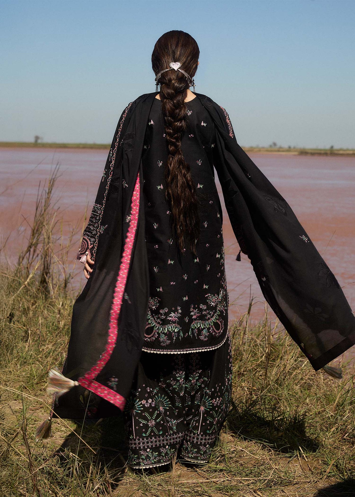 Model wearing black dress Siyah by Hussain Rehar, Pakistani luxury pret online in UK for festive wear and Eid.