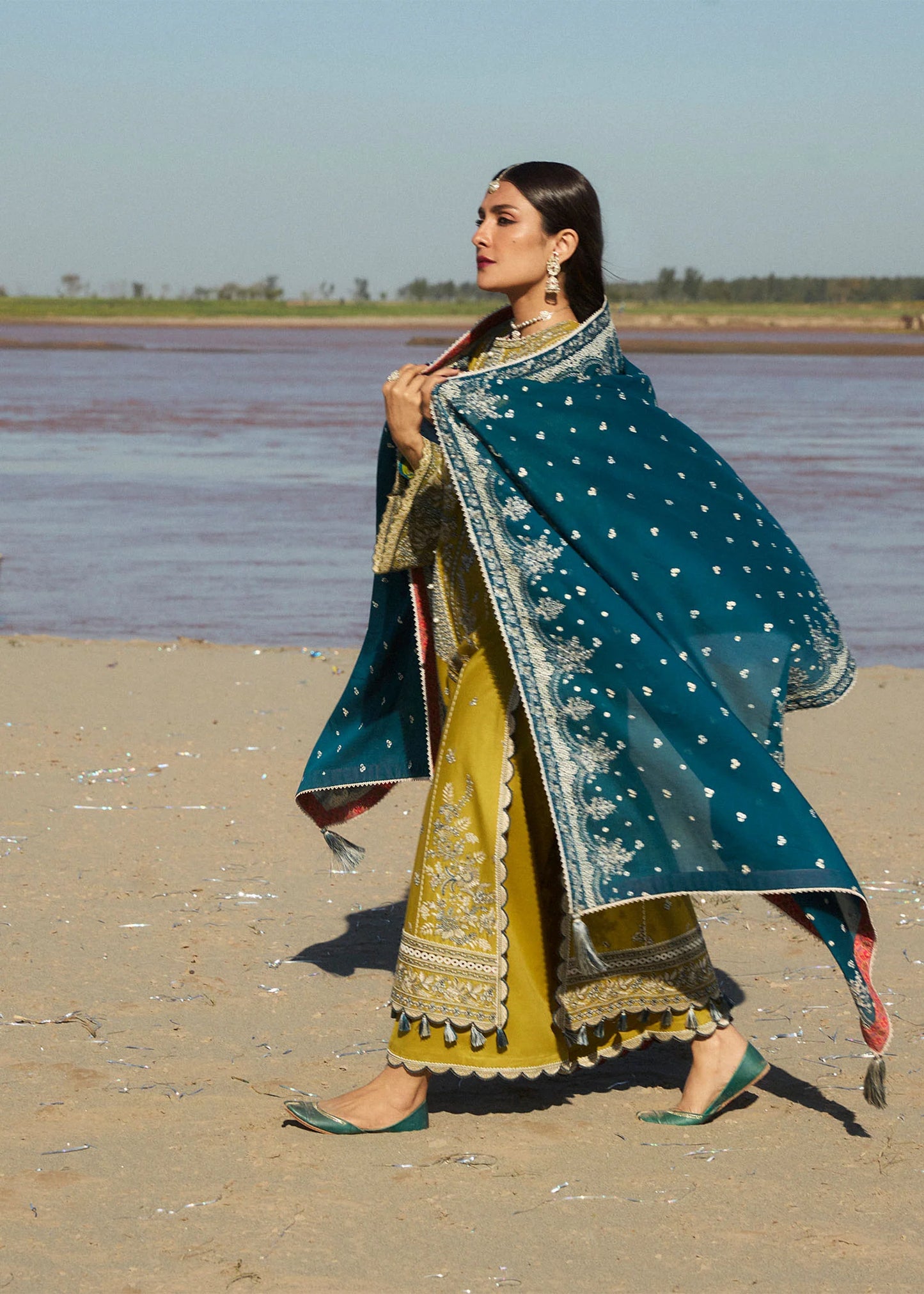 Model wearing mustard embroidered dress Shamyaana by Hussain Rehar, Pakistani luxury pret online in UK.