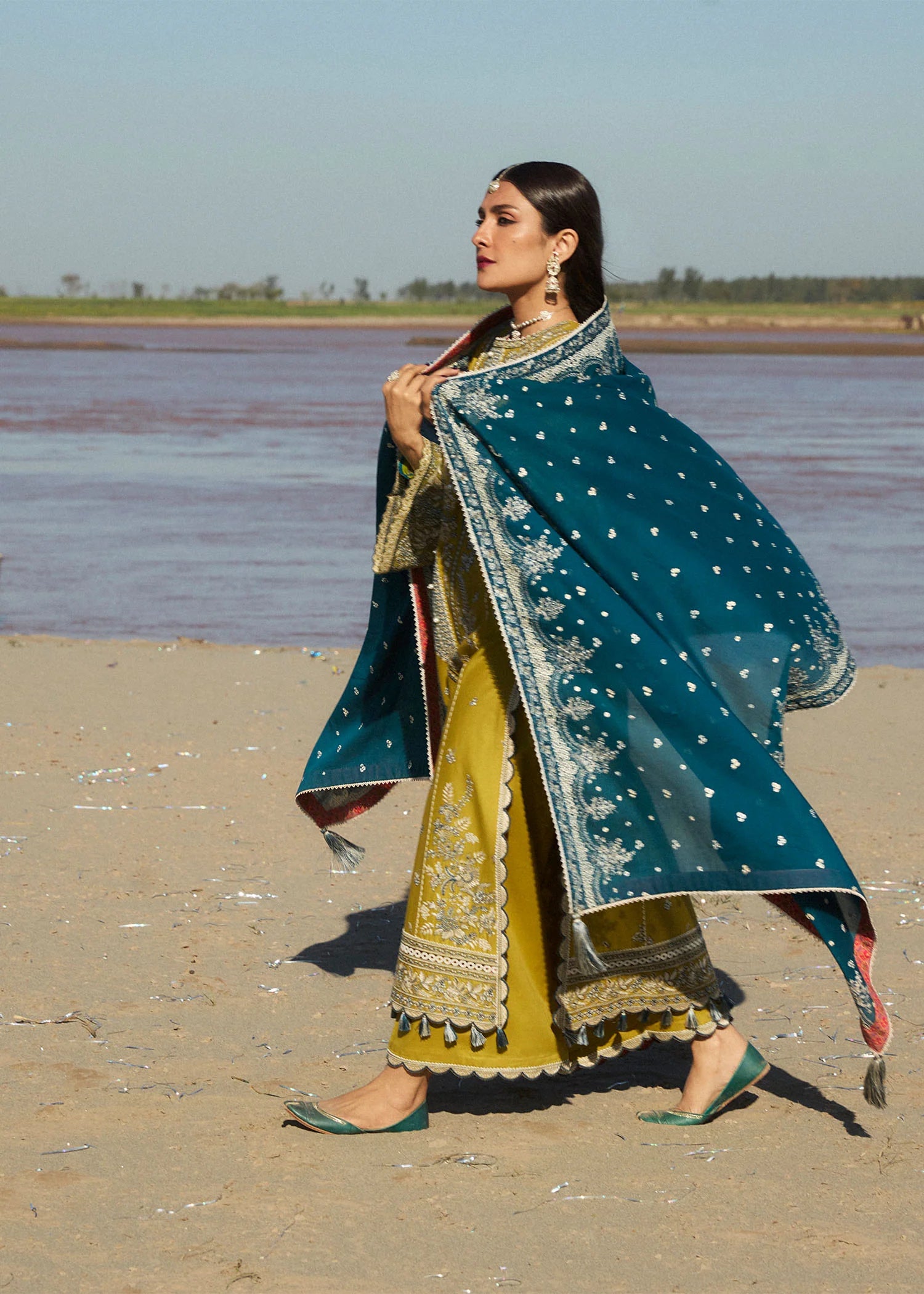 Model wearing mustard embroidered dress Shamyaana by Hussain Rehar, Pakistani luxury pret online in UK.