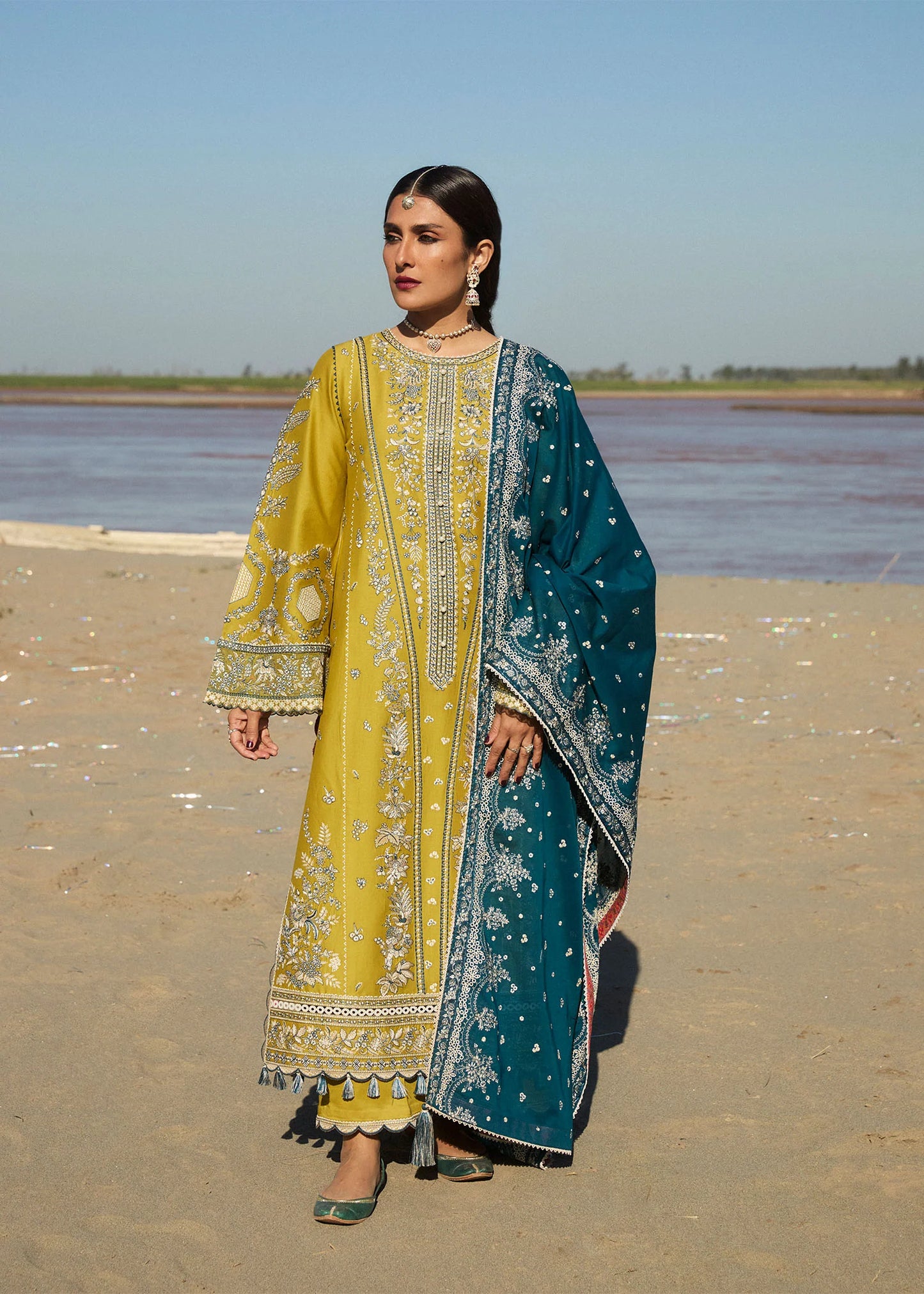 Model wearing mustard embroidered dress Shamyaana by Hussain Rehar, Pakistani luxury pret online in UK.