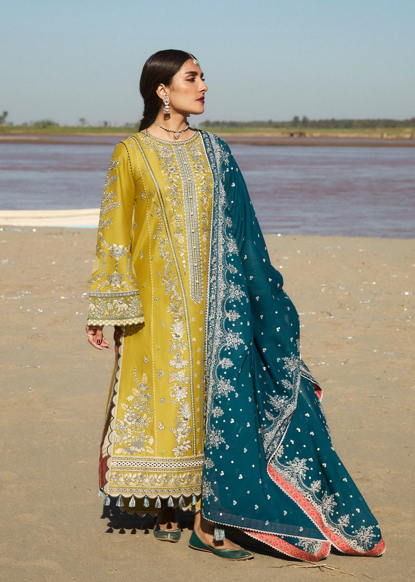 Model wearing mustard embroidered dress Shamyaana by Hussain Rehar, Pakistani luxury pret online in UK.