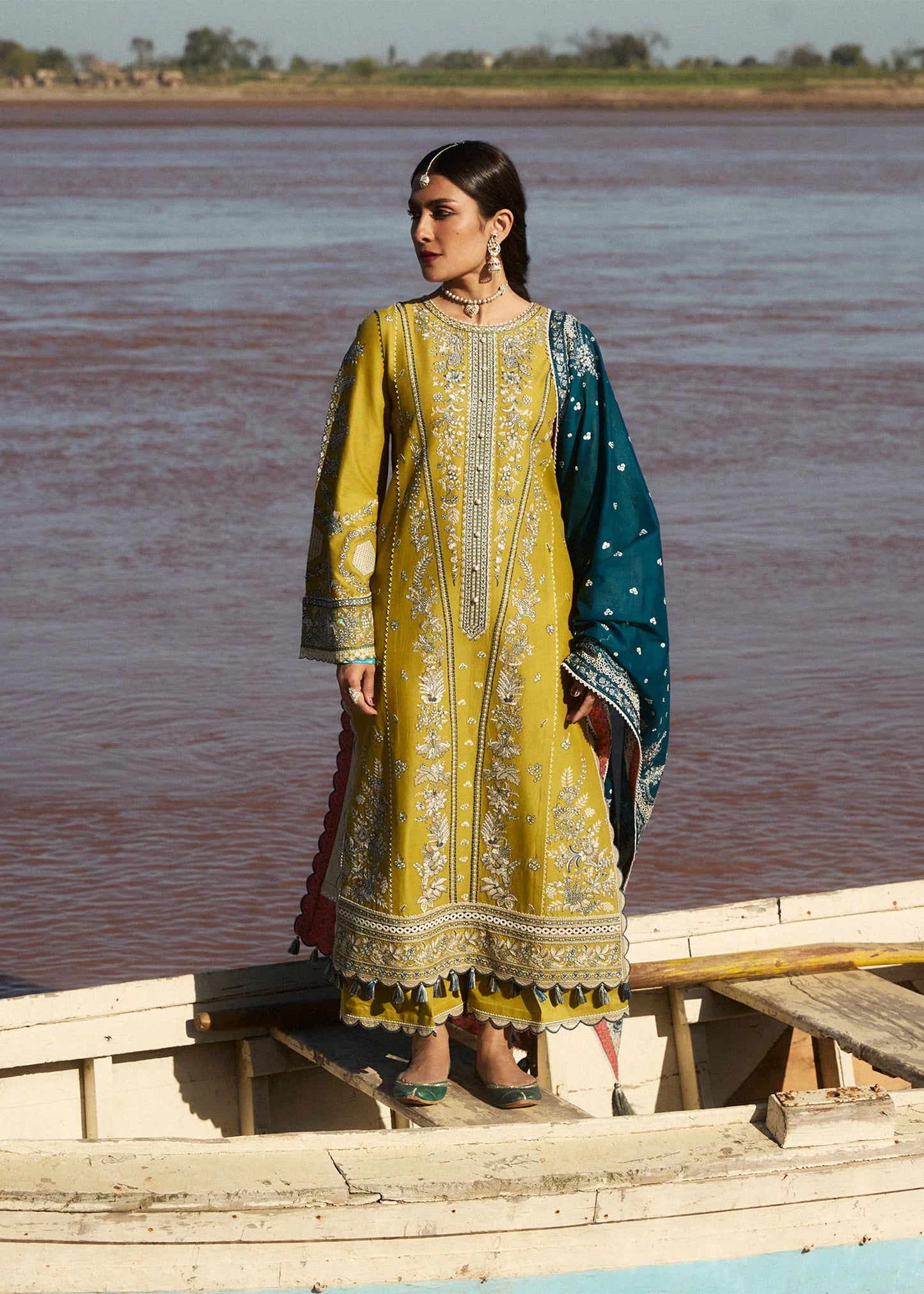Model wearing mustard embroidered dress Shamyaana by Hussain Rehar, Pakistani luxury pret online in UK.