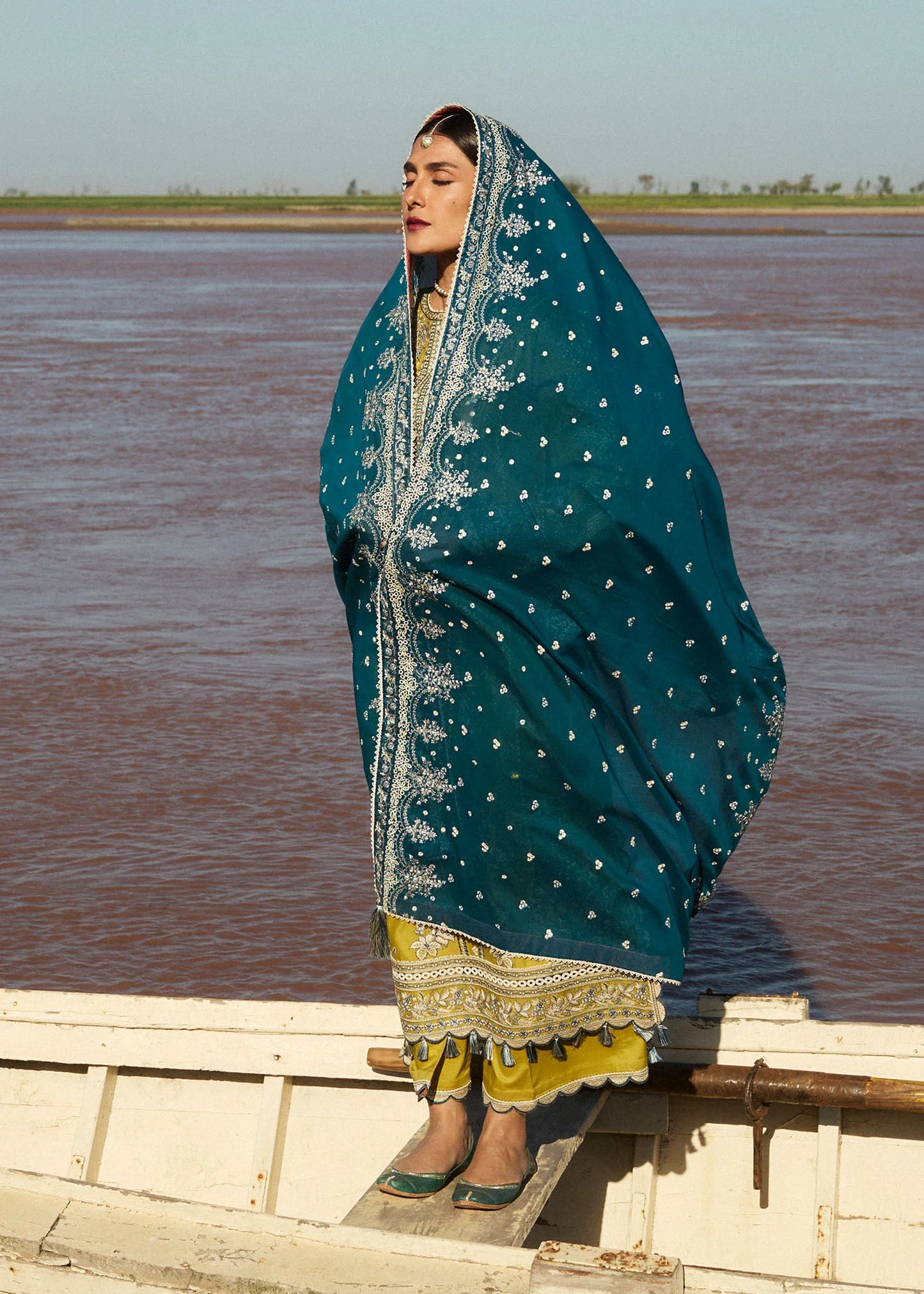 Model wearing mustard embroidered dress Shamyaana by Hussain Rehar, Pakistani luxury pret online in UK.