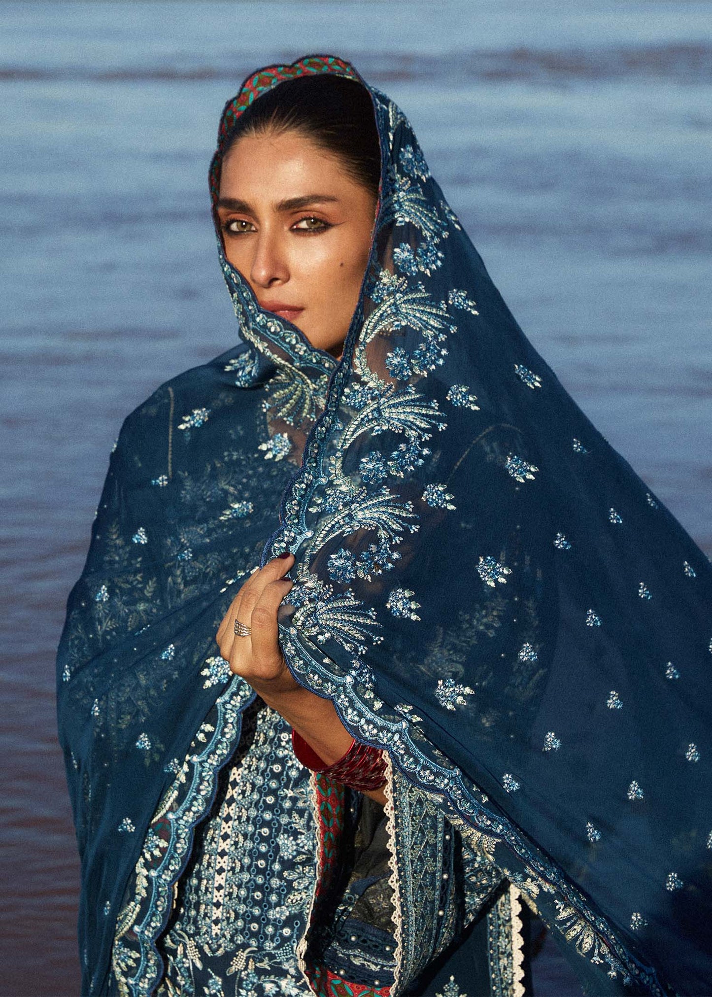 Model wearing navy blue dress Meherbano by Hussain Rehar, Pakistani luxury pret online in UK.