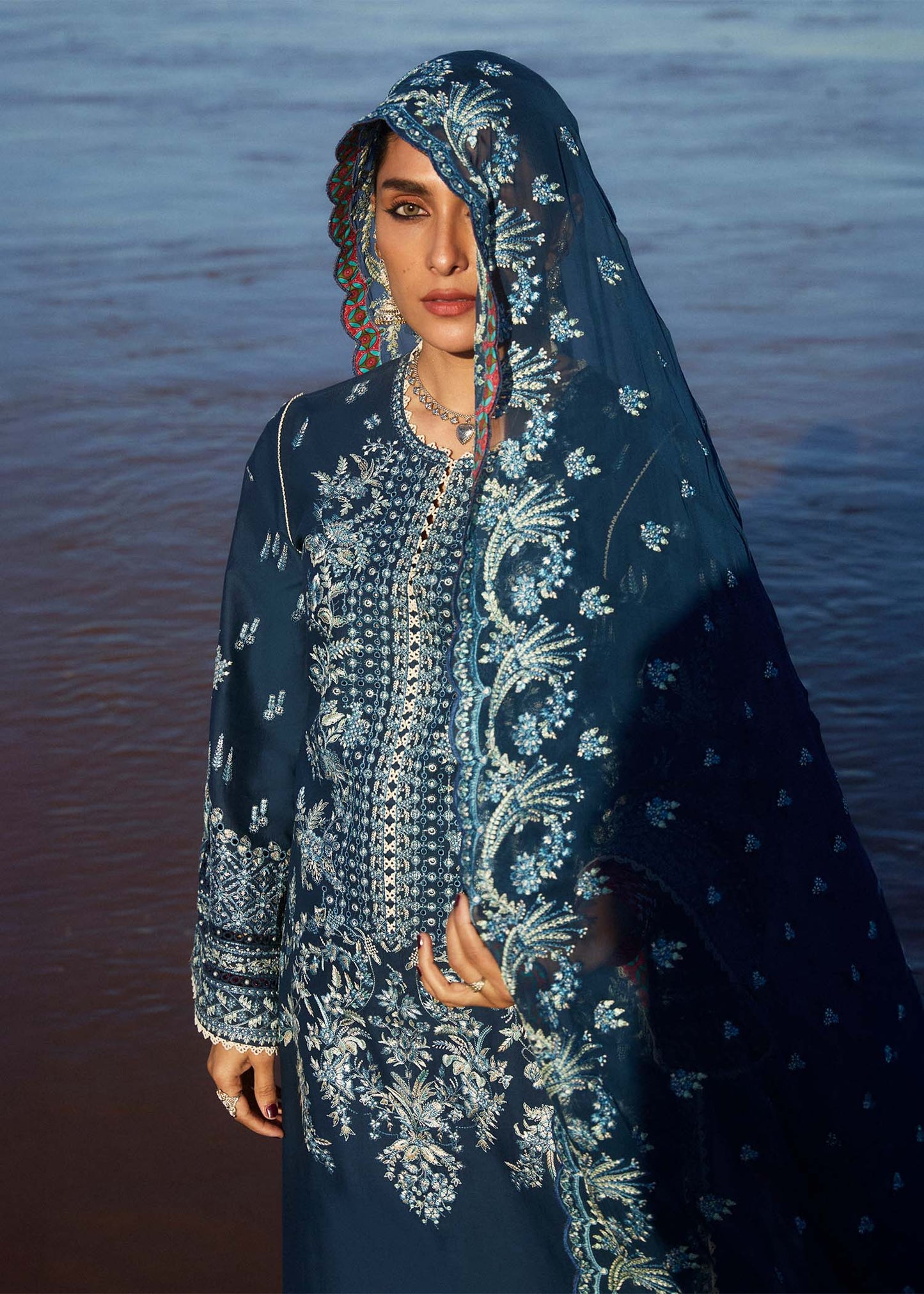 Model wearing navy blue dress Meherbano by Hussain Rehar, Pakistani luxury pret online in UK.