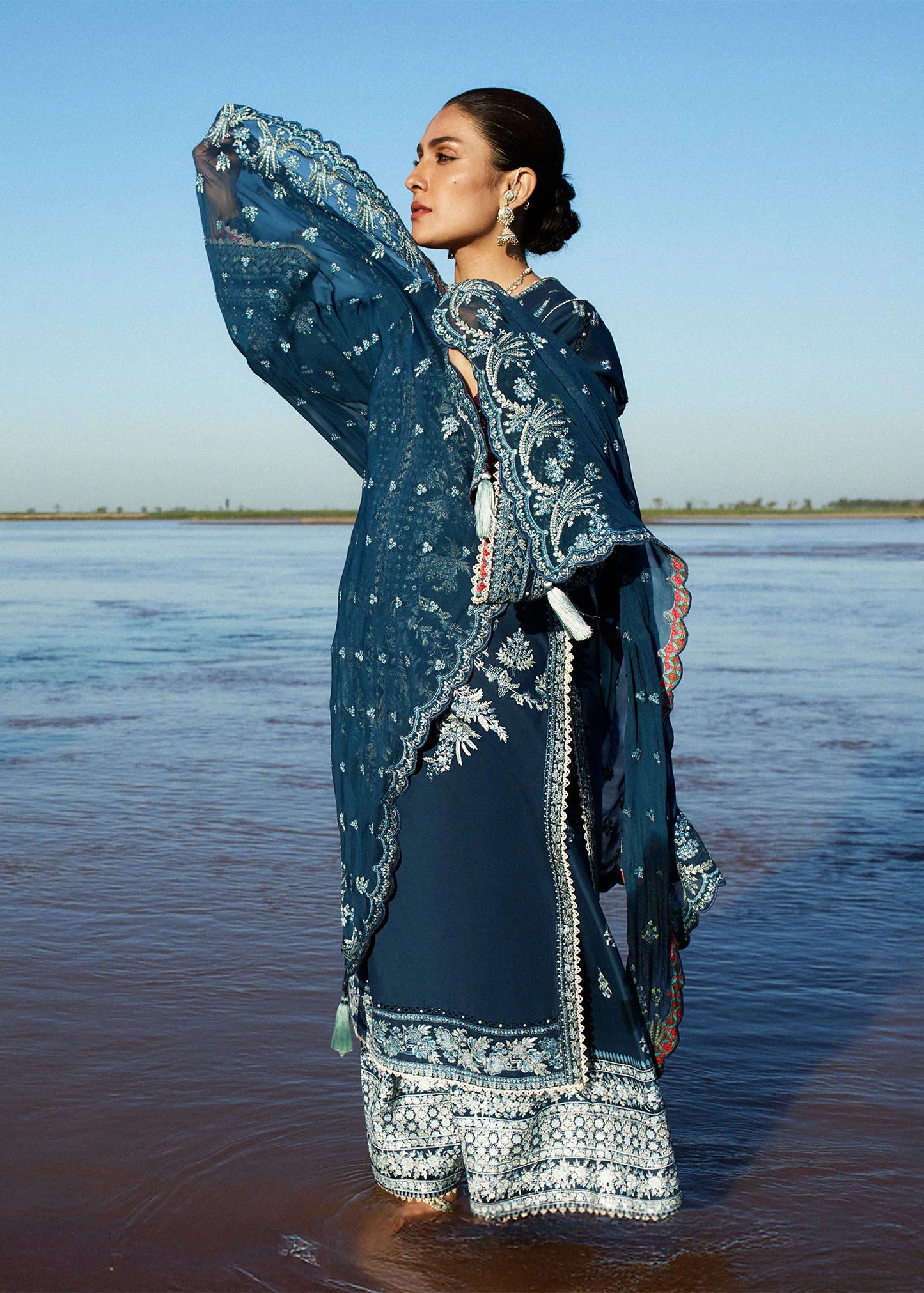 Model wearing navy blue dress Meherbano by Hussain Rehar, Pakistani luxury pret online in UK.