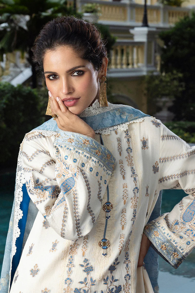 Model wearing ivory and powder blue Calafia dress from Mushq Seraph Jacquard Lawn '25, Pakistani Luxury pret, Pakistani clothes online in UK.