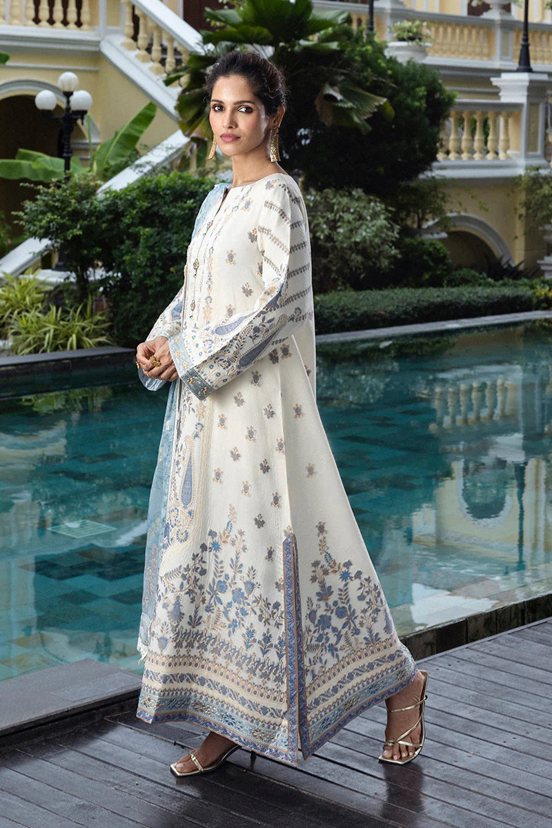Model wearing ivory and powder blue Calafia dress from Mushq Seraph Jacquard Lawn '25, Pakistani Luxury pret, Pakistani clothes online in UK.