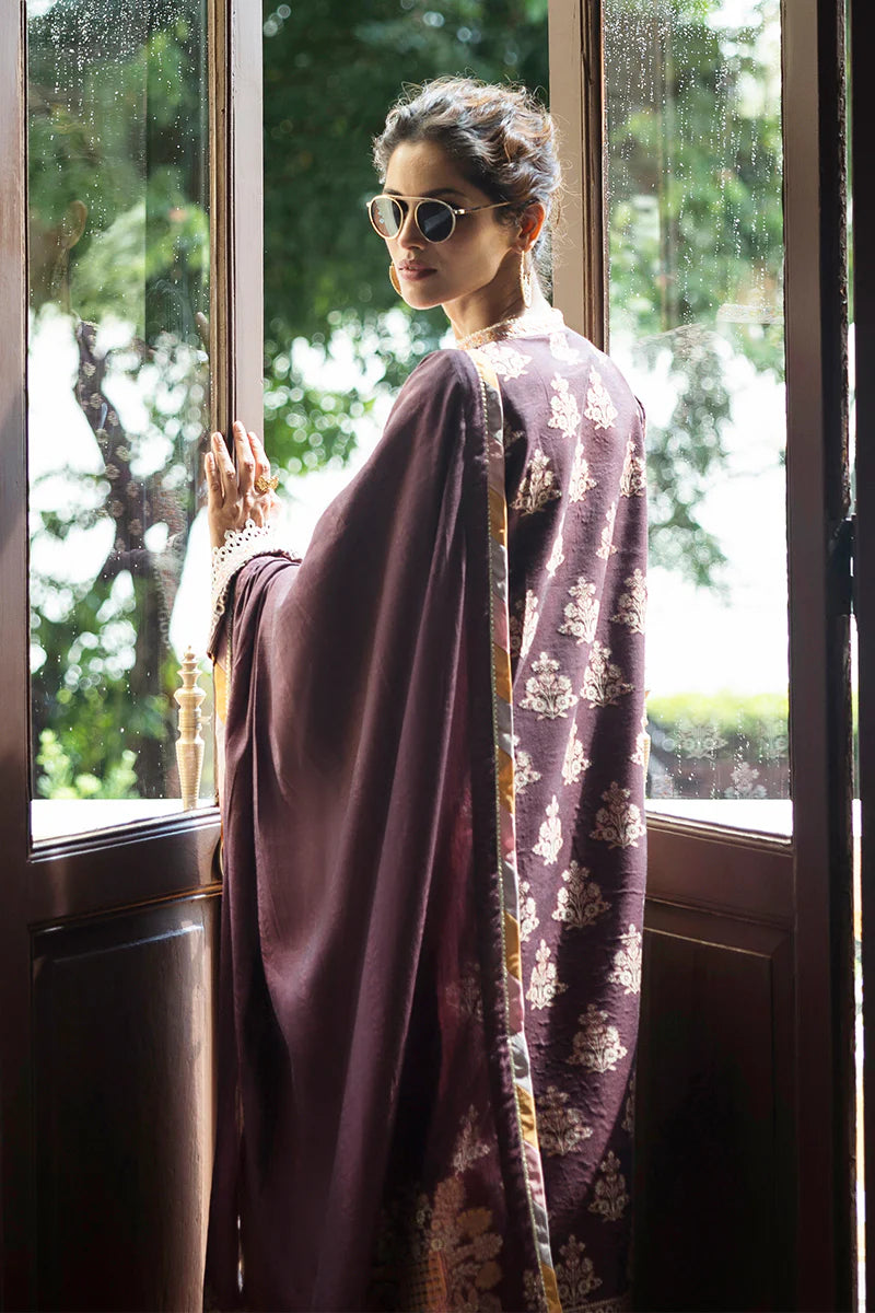 Model wearing deep plum and gold Narissa dress from Mushq Seraph Jacquard Lawn '25, Pakistani Luxury pret, Pakistani clothes online in UK.