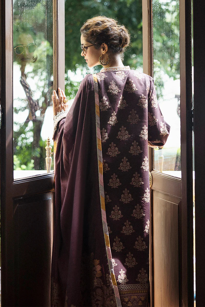 Model wearing deep plum and gold Narissa dress from Mushq Seraph Jacquard Lawn '25, Pakistani Luxury pret, Pakistani clothes online in UK.