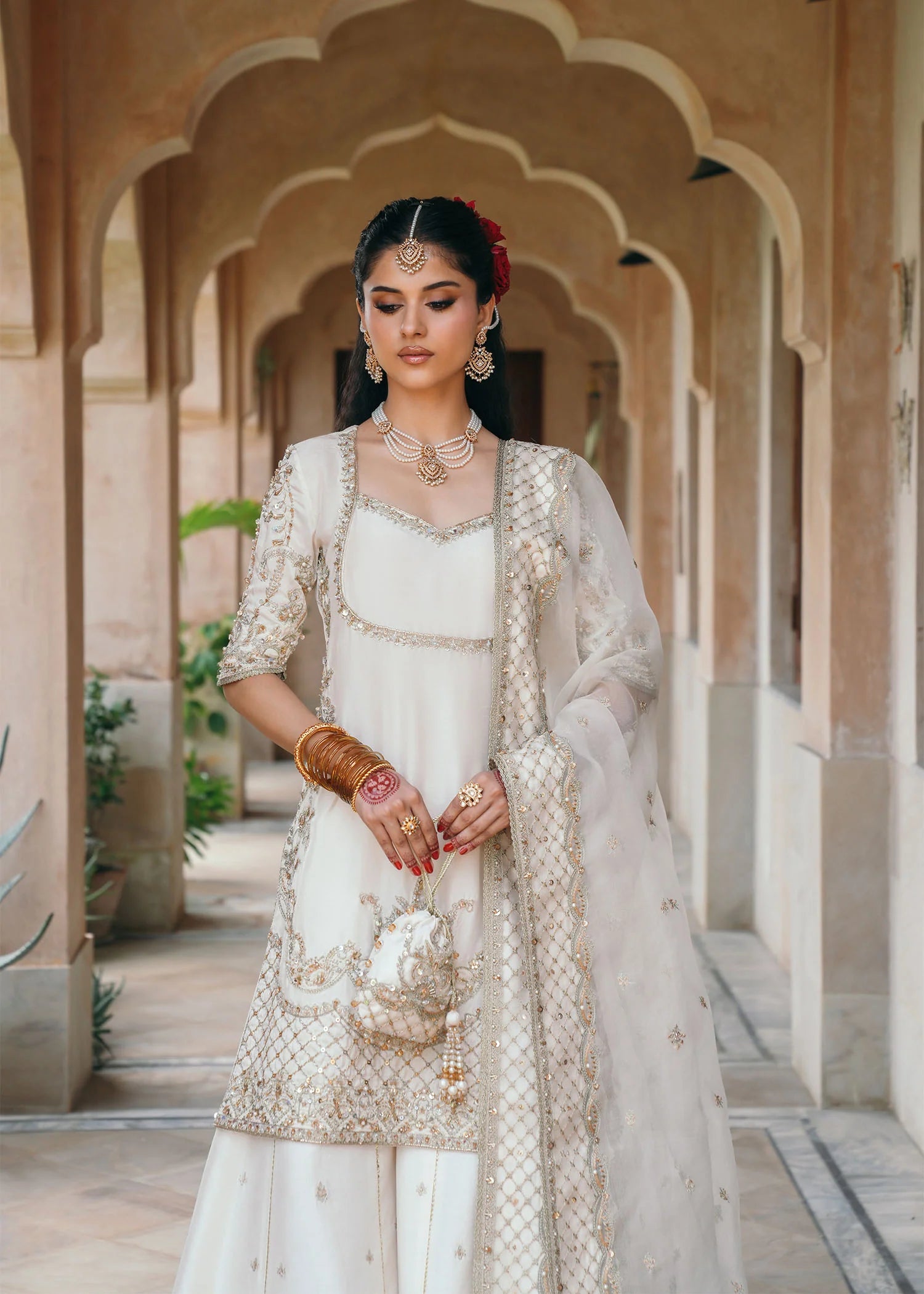 Model wearing Jaya by Kanwal Malik in ivory with gold embellishments – timeless Pakistani luxury pret outfit in UK.