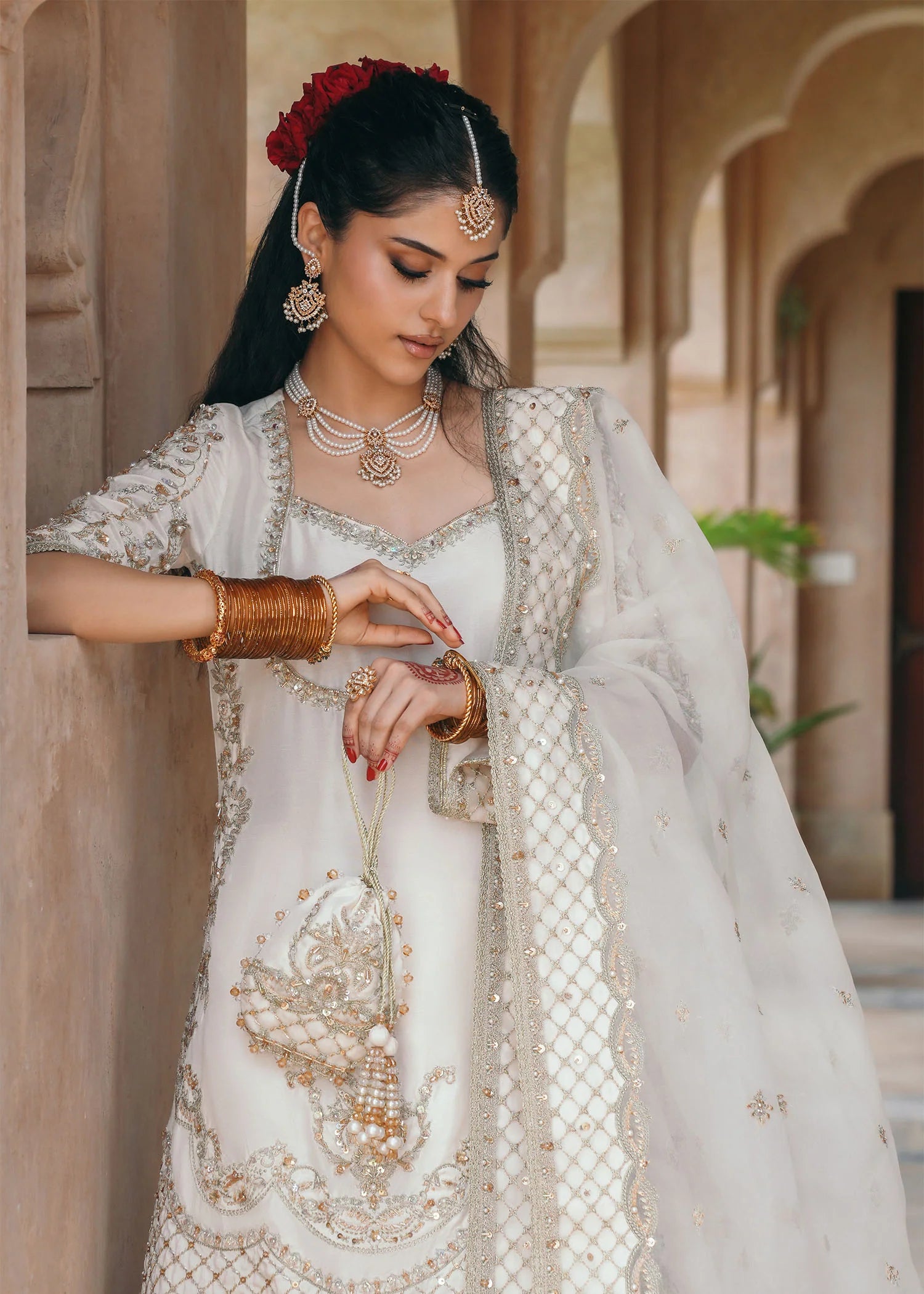 Model wearing Jaya by Kanwal Malik in ivory with gold embellishments – timeless Pakistani luxury pret outfit in UK.