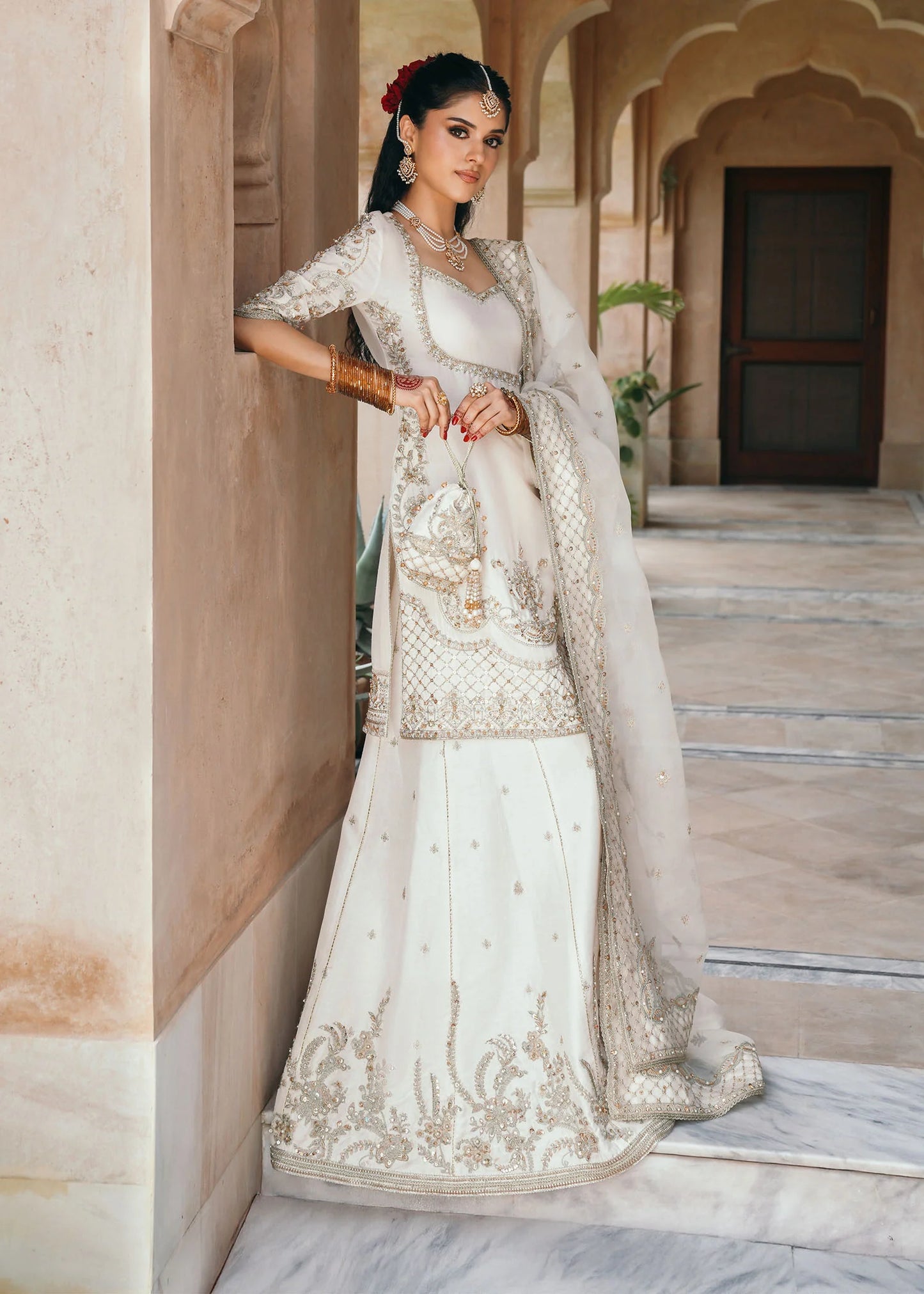 Model wearing Jaya by Kanwal Malik in ivory with gold embellishments – timeless Pakistani luxury pret outfit in UK.