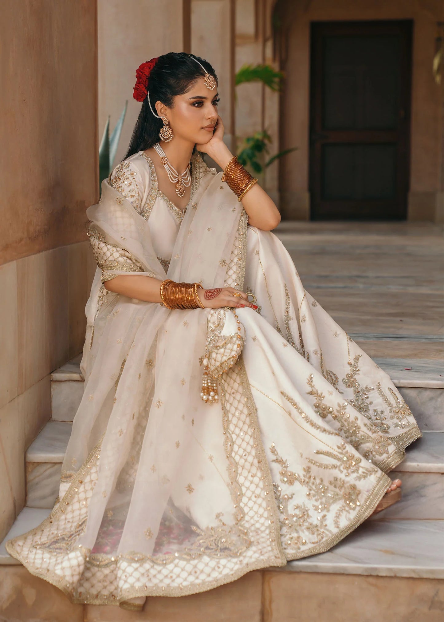 Model wearing Jaya by Kanwal Malik in ivory with gold embellishments – timeless Pakistani luxury pret outfit in UK.