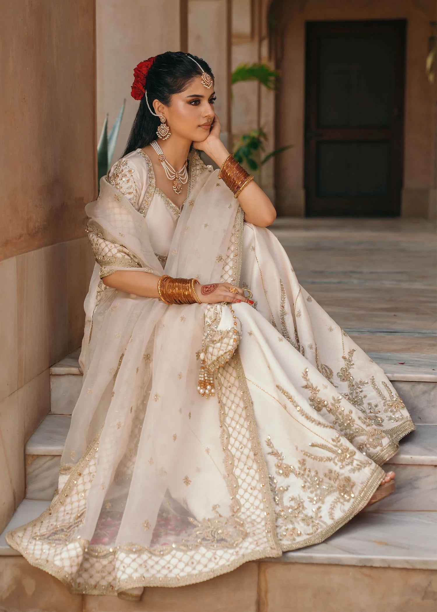 Model wearing Jaya by Kanwal Malik in ivory with gold embellishments – timeless Pakistani luxury pret outfit in UK.
