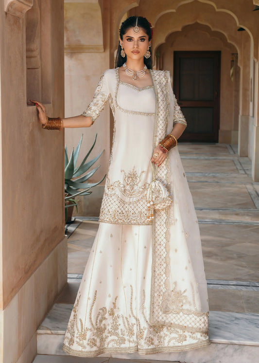 Model wearing Jaya by Kanwal Malik in ivory with gold embellishments – timeless Pakistani luxury pret outfit in UK.