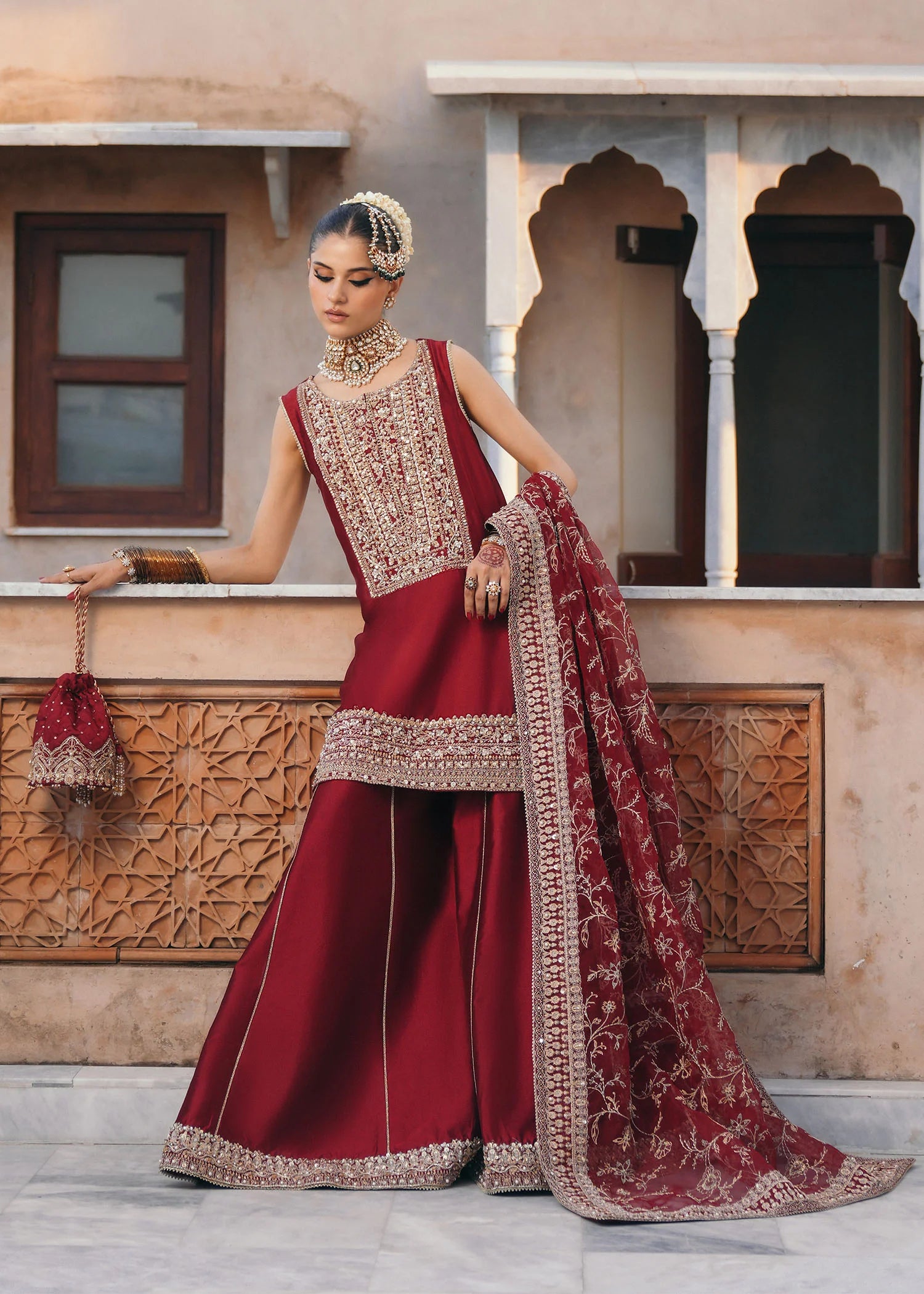 Model wearing Mehek by Kanwal Malik in deep maroon with gold embroidery and net dupatta – elegant Pakistani luxury pret outfit in UK.
