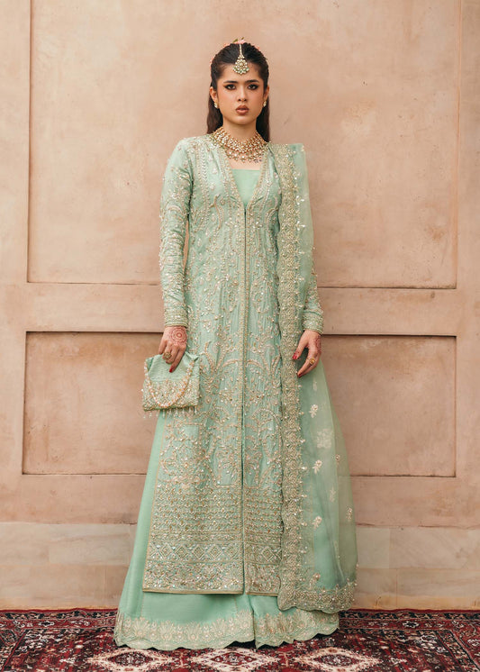 Model wearing Kaneez by Kanwal Malik in mint green with gold embroidery – luxurious Pakistani luxury pret outfit in UK.