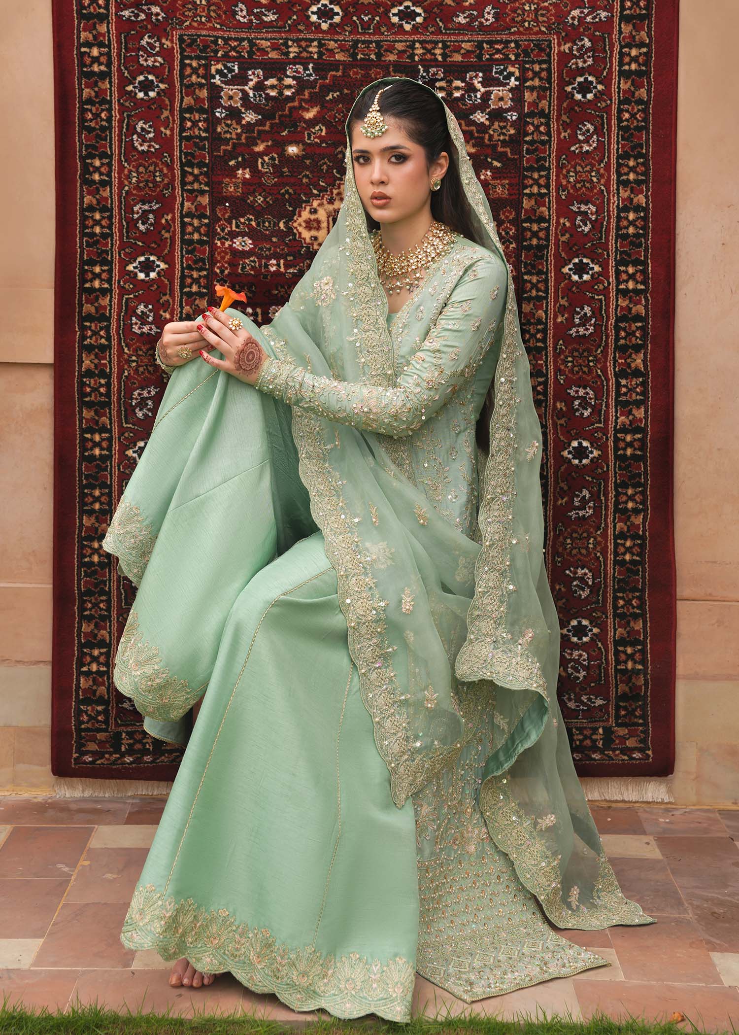 Model wearing Kaneez by Kanwal Malik in mint green with gold embroidery – luxurious Pakistani luxury pret outfit in UK.