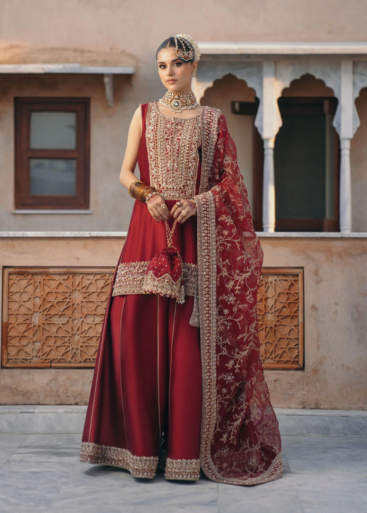 Model wearing Mehek by Kanwal Malik in deep maroon with gold embroidery and net dupatta – elegant Pakistani luxury pret outfit in UK.