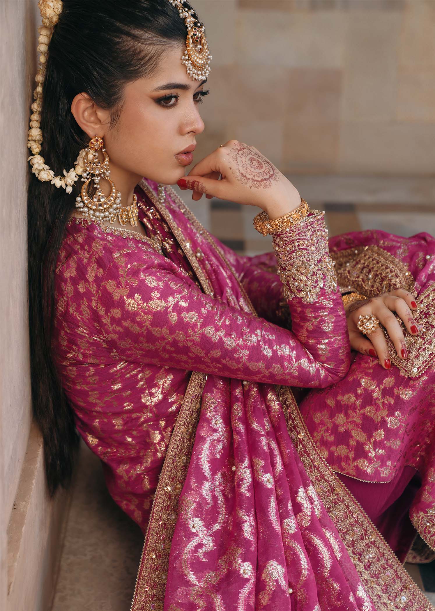 Model wearing Rano by Kanwal Malik in hot pink with intricate gold detailing – vibrant Pakistani luxury pret outfit in UK.