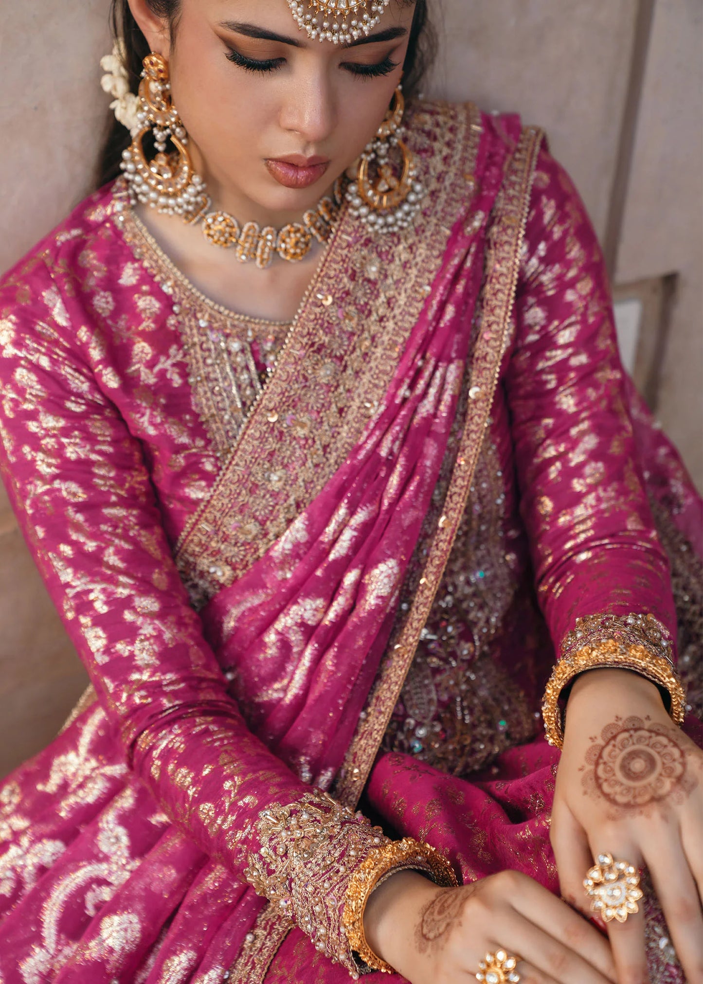 Model wearing Rano by Kanwal Malik in hot pink with intricate gold detailing – vibrant Pakistani luxury pret outfit in UK.