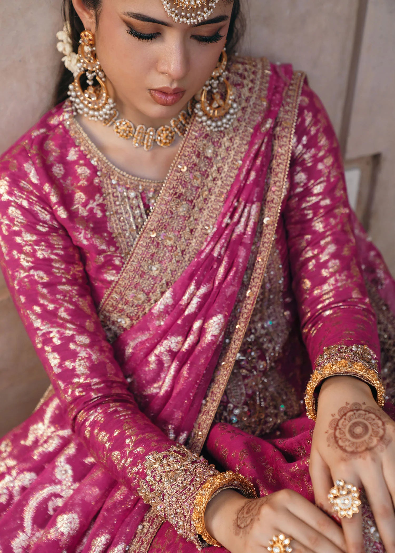 Model wearing Rano by Kanwal Malik in hot pink with intricate gold detailing – vibrant Pakistani luxury pret outfit in UK.