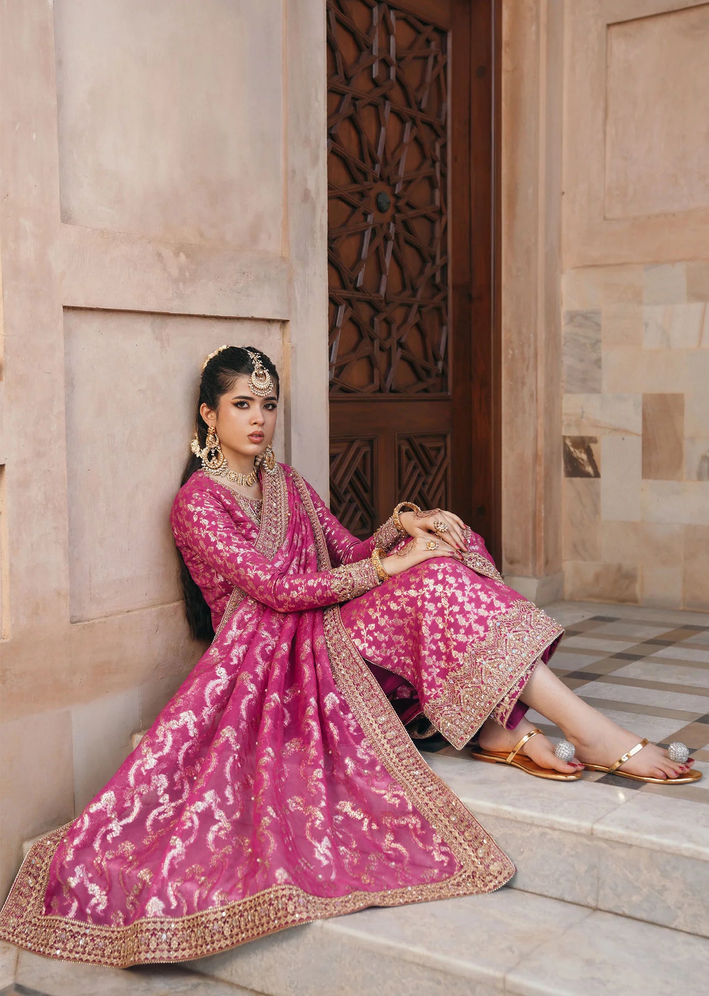 Model wearing Rano by Kanwal Malik in hot pink with intricate gold detailing – vibrant Pakistani luxury pret outfit in UK.