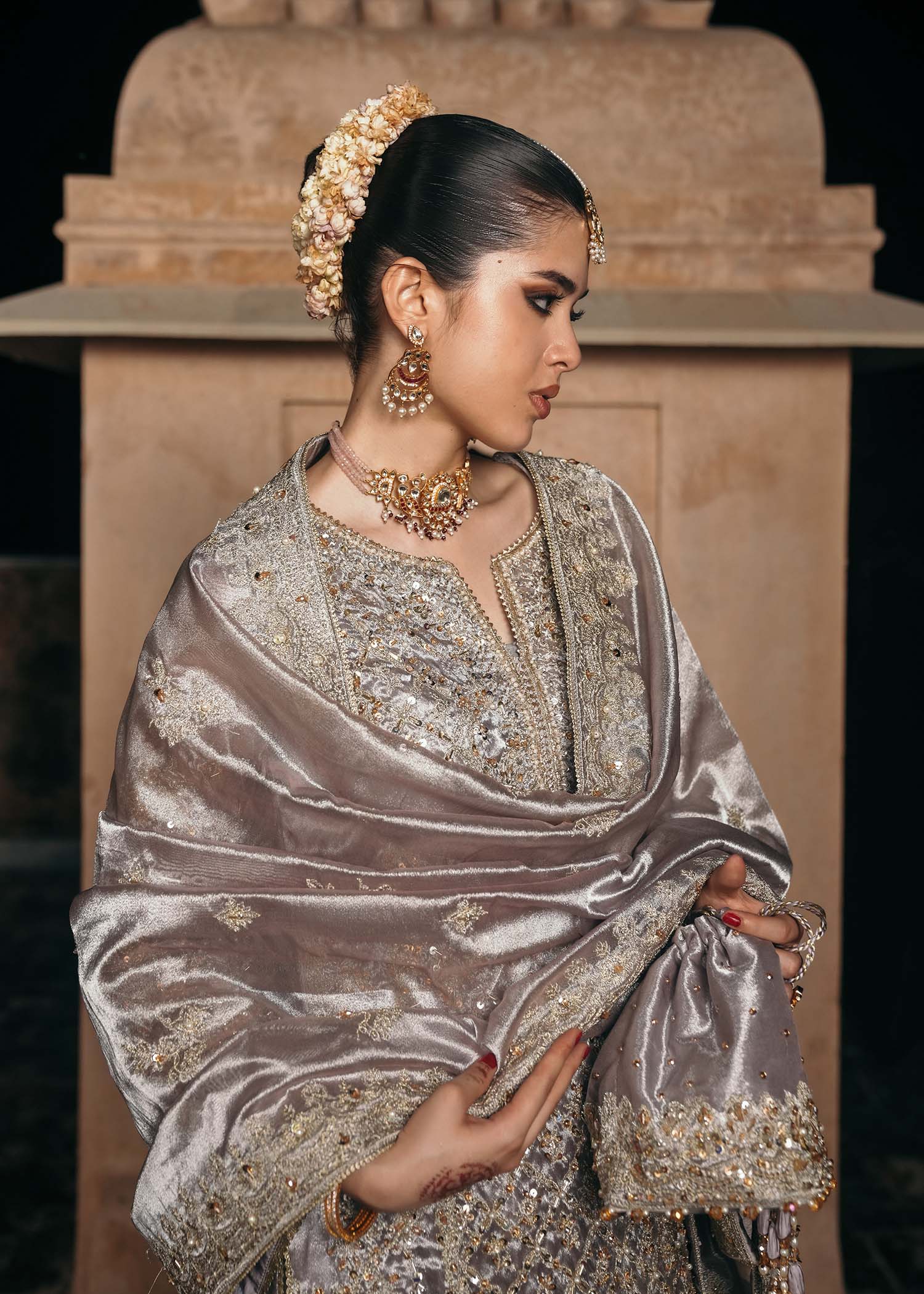 Model wearing Gulnaar by Kanwal Malik in metallic silver with intricate embellishments – elegant Pakistani luxury pret outfit in UK.