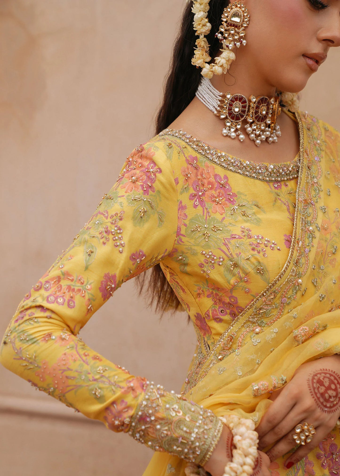 Model wearing Hoorain by Kanwal Malik in vibrant yellow with floral embroidery – festive Pakistani luxury pret outfit in UK.