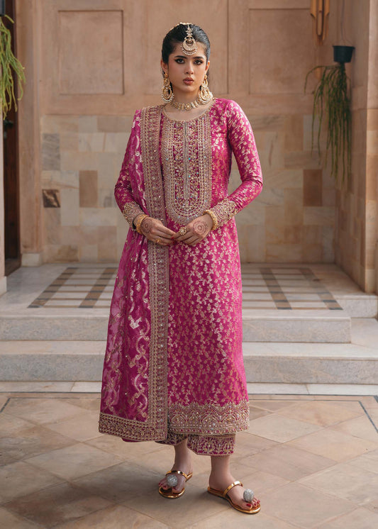 Model wearing Rano by Kanwal Malik in hot pink with intricate gold detailing – vibrant Pakistani luxury pret outfit in UK.
