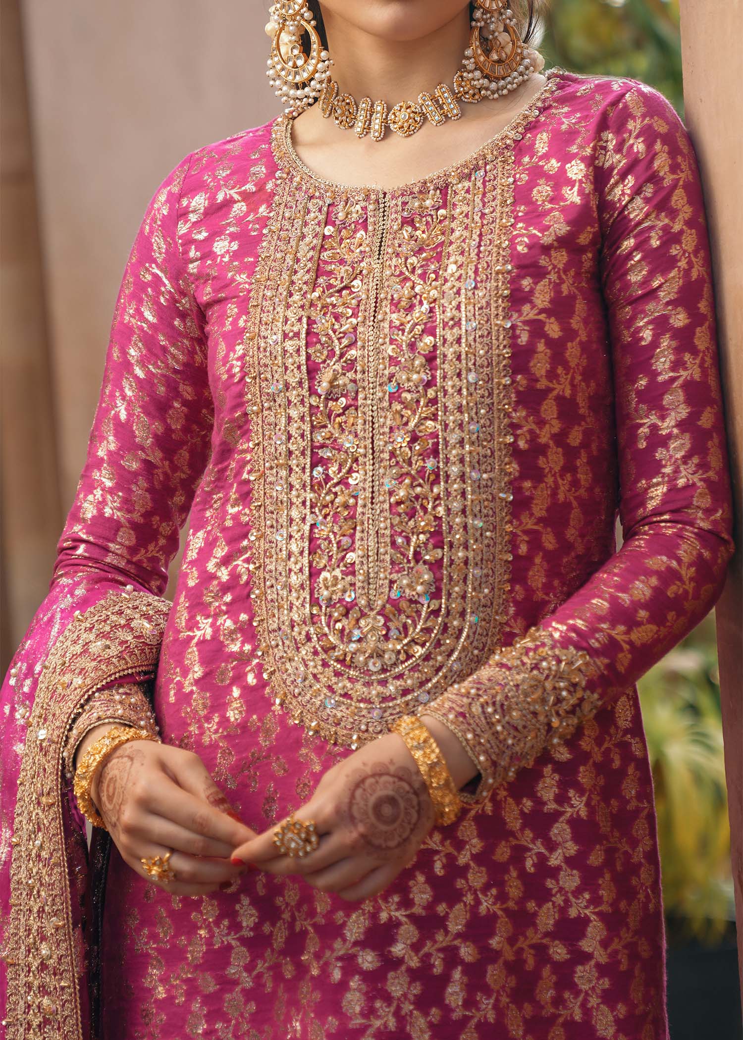 Model wearing Rano by Kanwal Malik in hot pink with intricate gold detailing – vibrant Pakistani luxury pret outfit in UK.