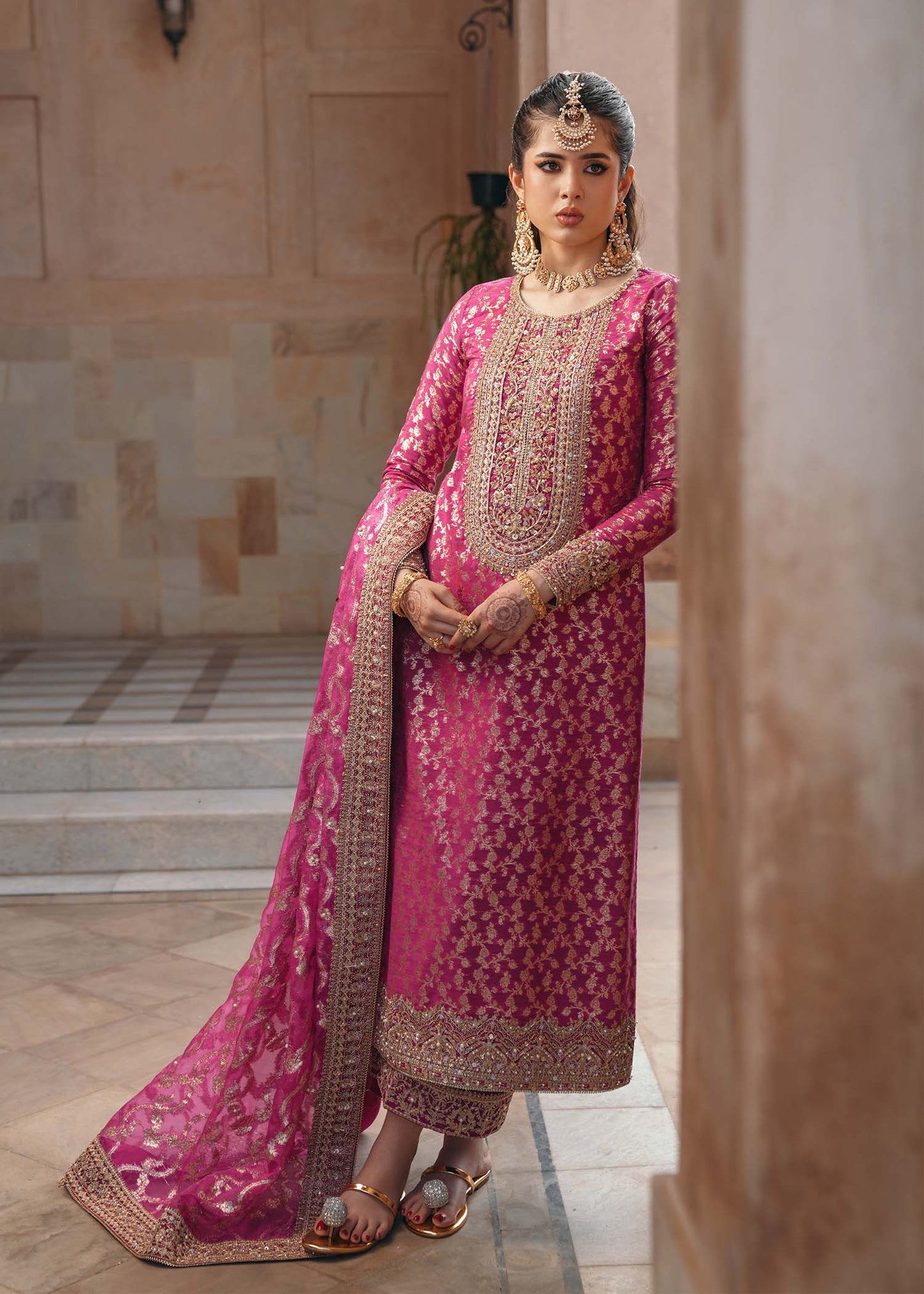 Model wearing Rano by Kanwal Malik in hot pink with intricate gold detailing – vibrant Pakistani luxury pret outfit in UK.