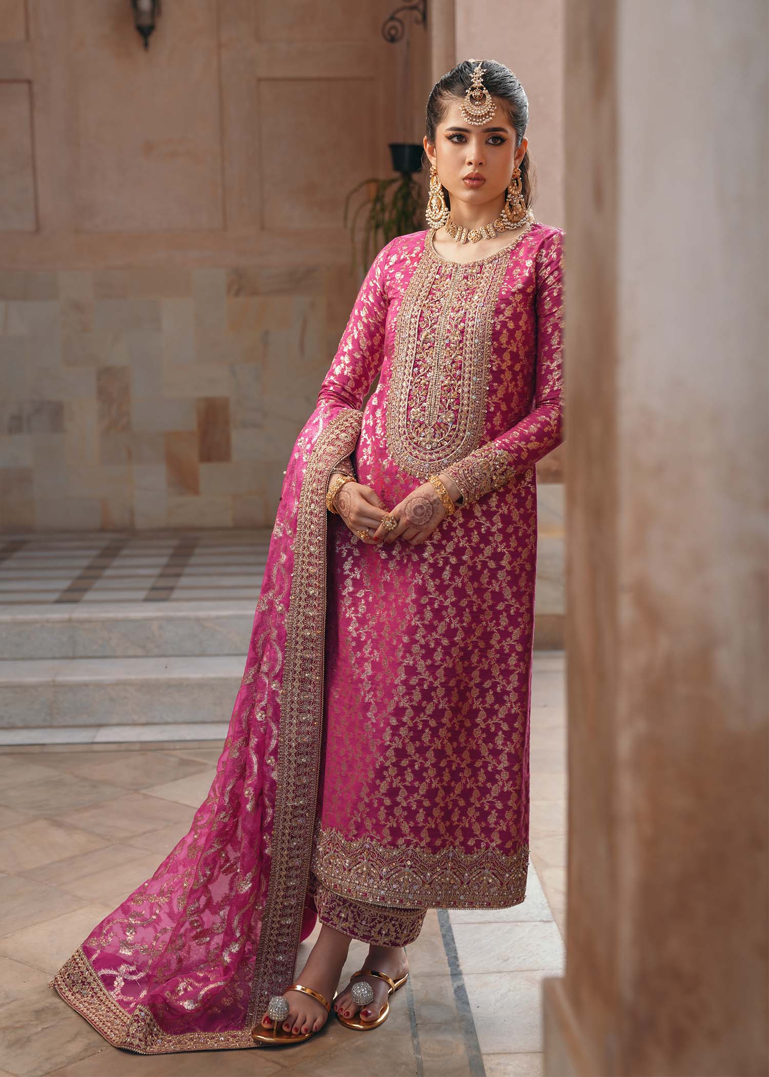 Model wearing Rano by Kanwal Malik in hot pink with intricate gold detailing – vibrant Pakistani luxury pret outfit in UK.