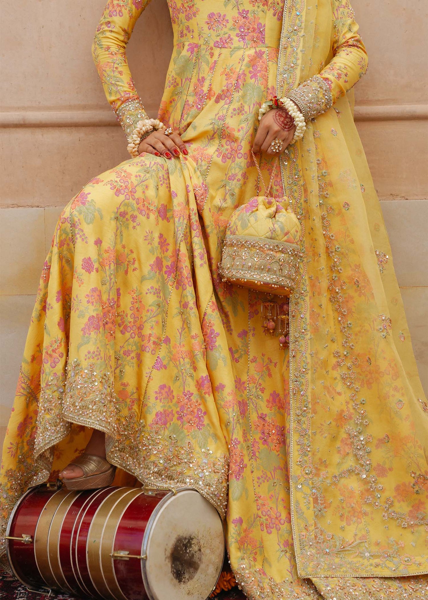 Model wearing Hoorain by Kanwal Malik in vibrant yellow with floral embroidery – festive Pakistani luxury pret outfit in UK.