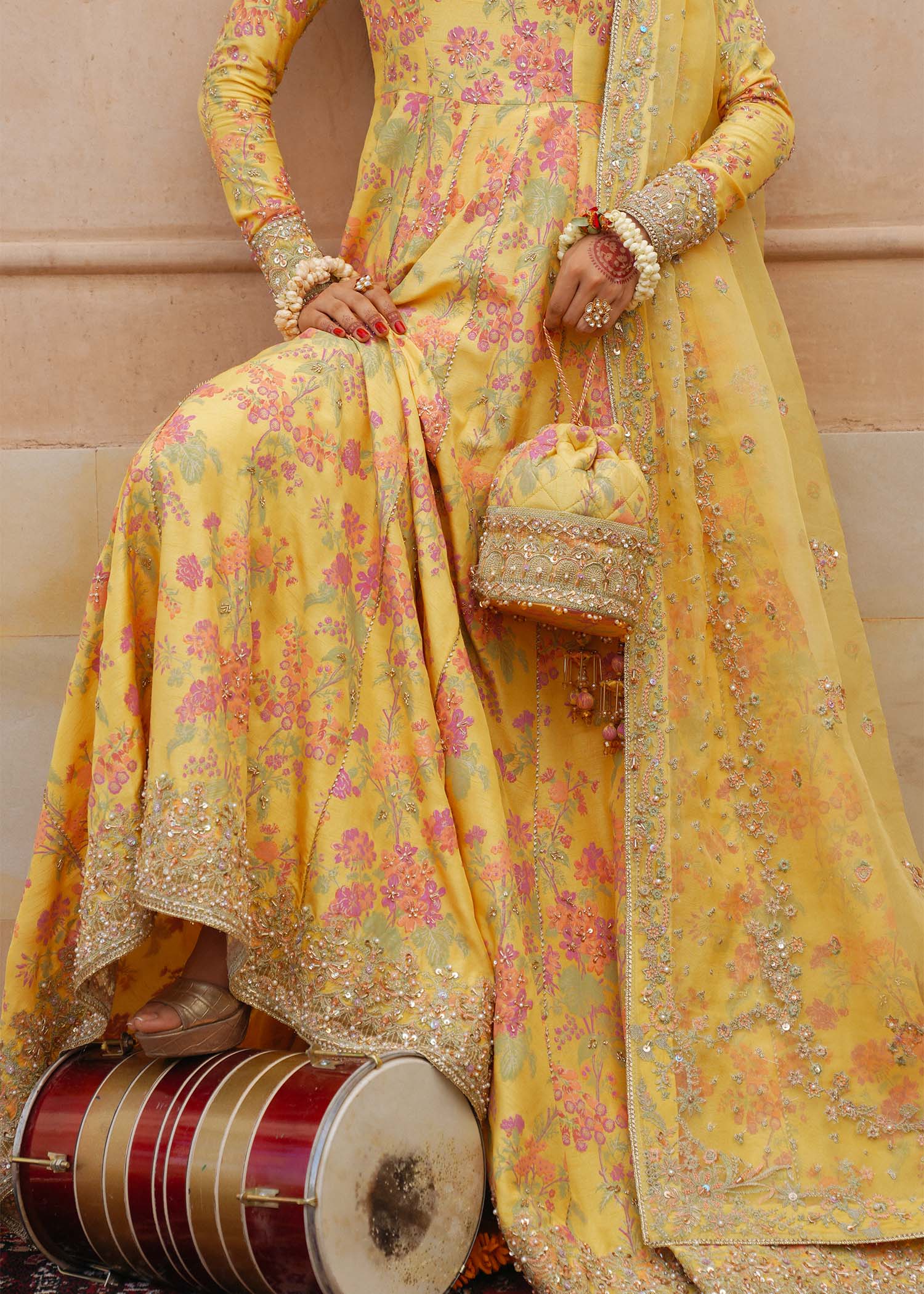 Model wearing Hoorain by Kanwal Malik in vibrant yellow with floral embroidery – festive Pakistani luxury pret outfit in UK.