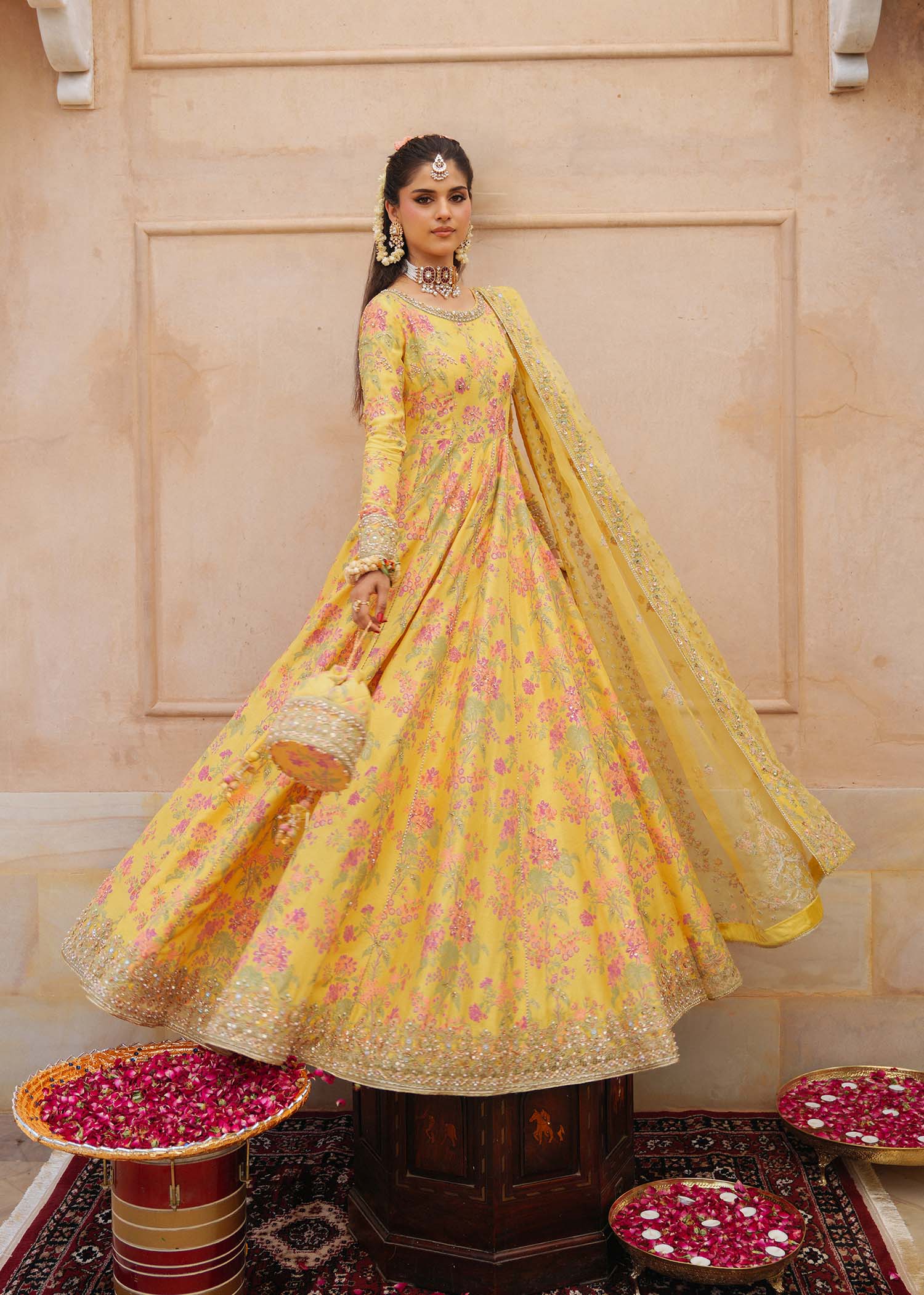 Model wearing Hoorain by Kanwal Malik in vibrant yellow with floral embroidery – festive Pakistani luxury pret outfit in UK.