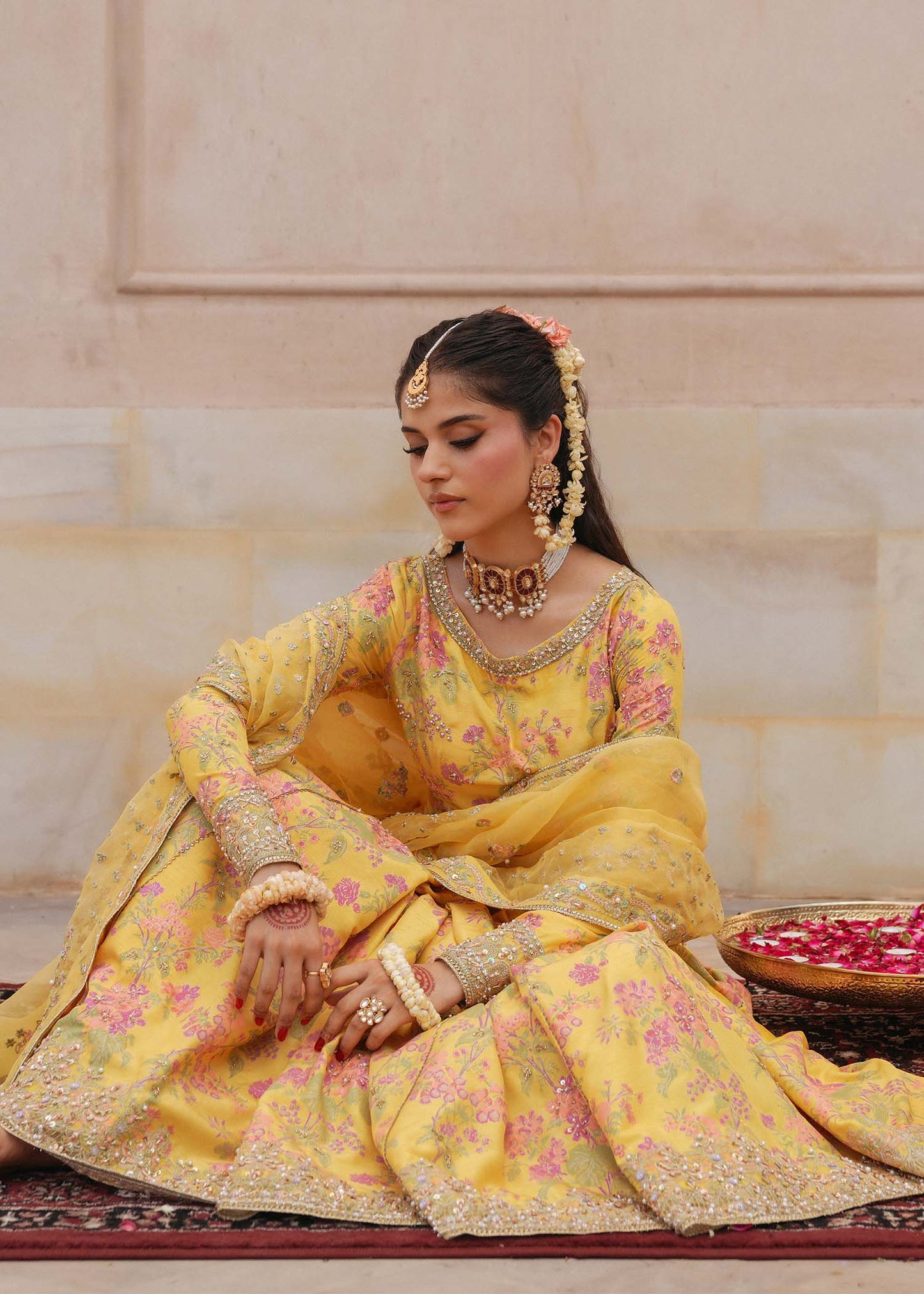 Model wearing Hoorain by Kanwal Malik in vibrant yellow with floral embroidery – festive Pakistani luxury pret outfit in UK.