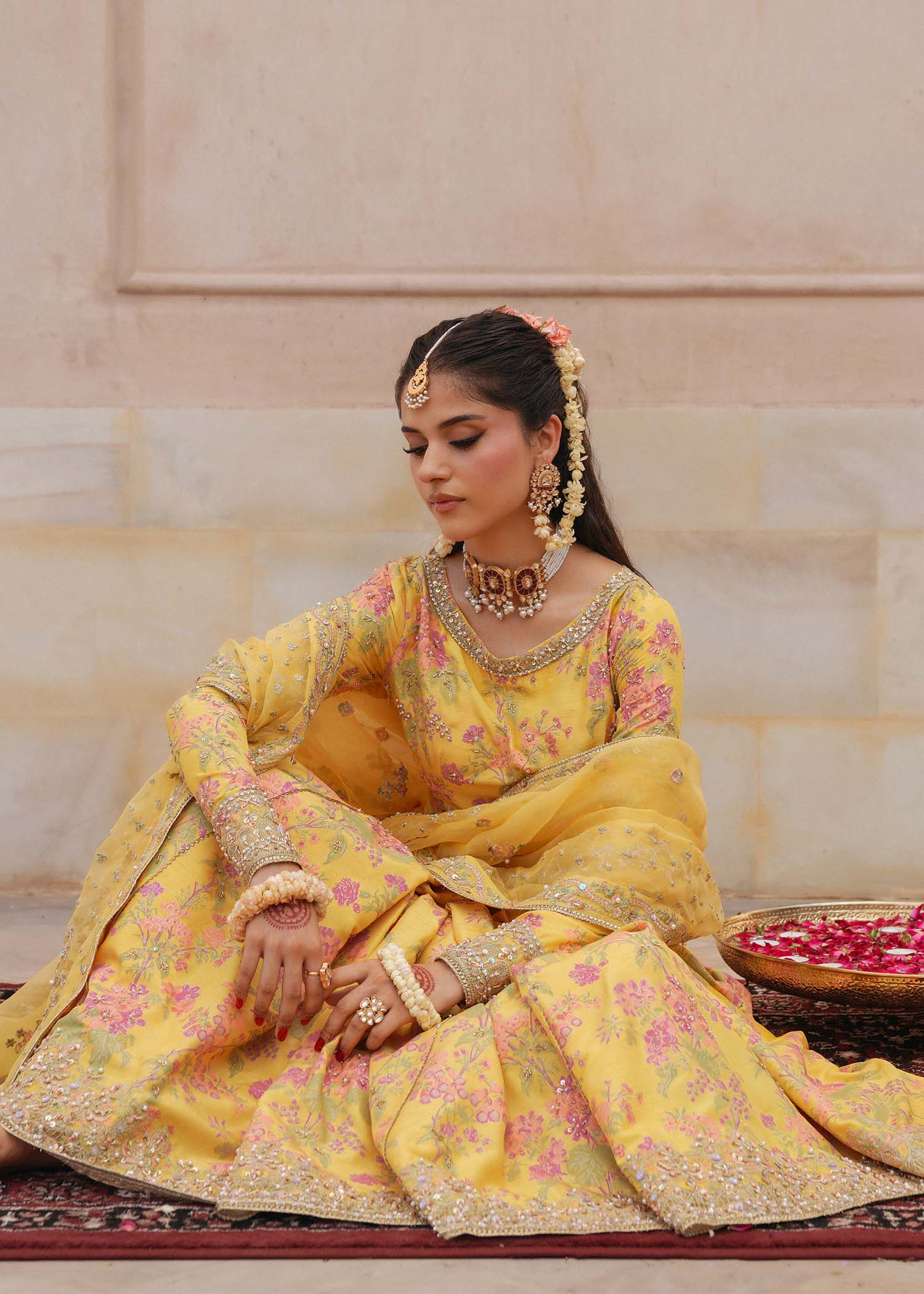 Model wearing Hoorain by Kanwal Malik in vibrant yellow with floral embroidery – festive Pakistani luxury pret outfit in UK.