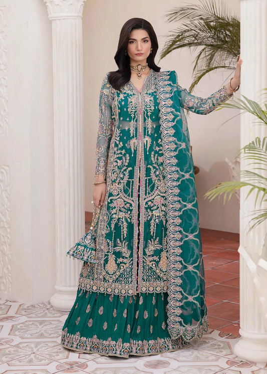 Model wearing teal green Maya dress by Kanwal Malik with intricate embroidery—Pakistani luxury pret available online in UK.