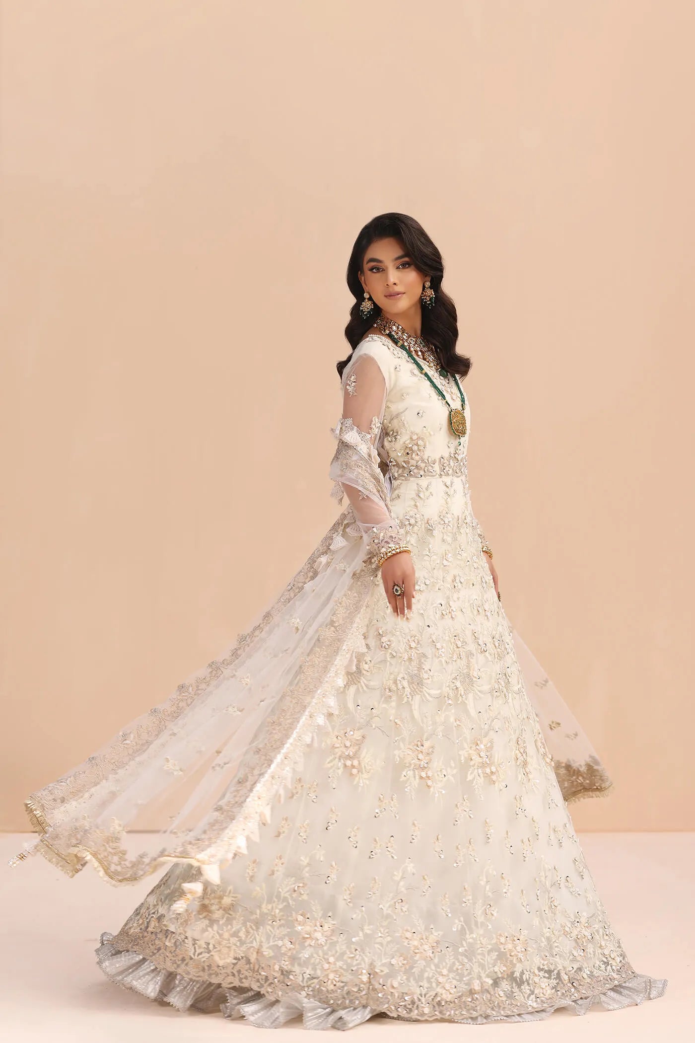 Model in Musferah Saad Ivory Elegance white Pakistani wedding dress, UK.