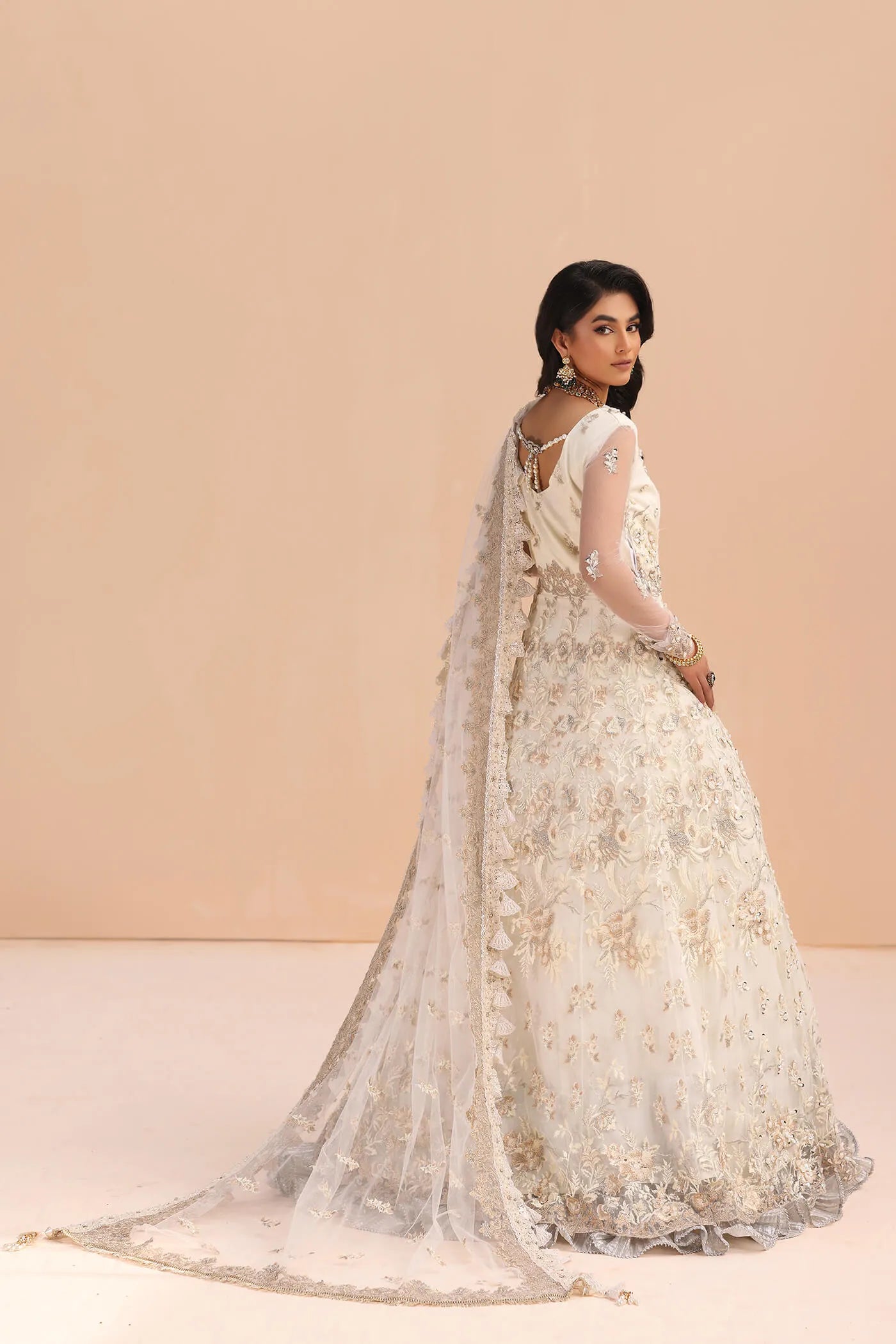 Model in Musferah Saad Ivory Elegance white Pakistani wedding dress, UK.