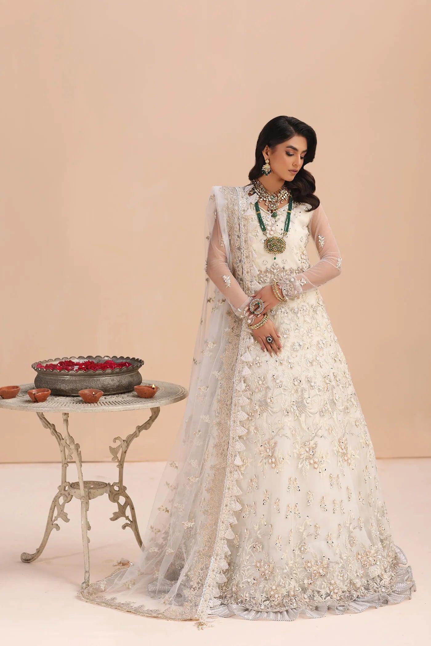 Model in Musferah Saad Ivory Elegance white Pakistani wedding dress, UK.