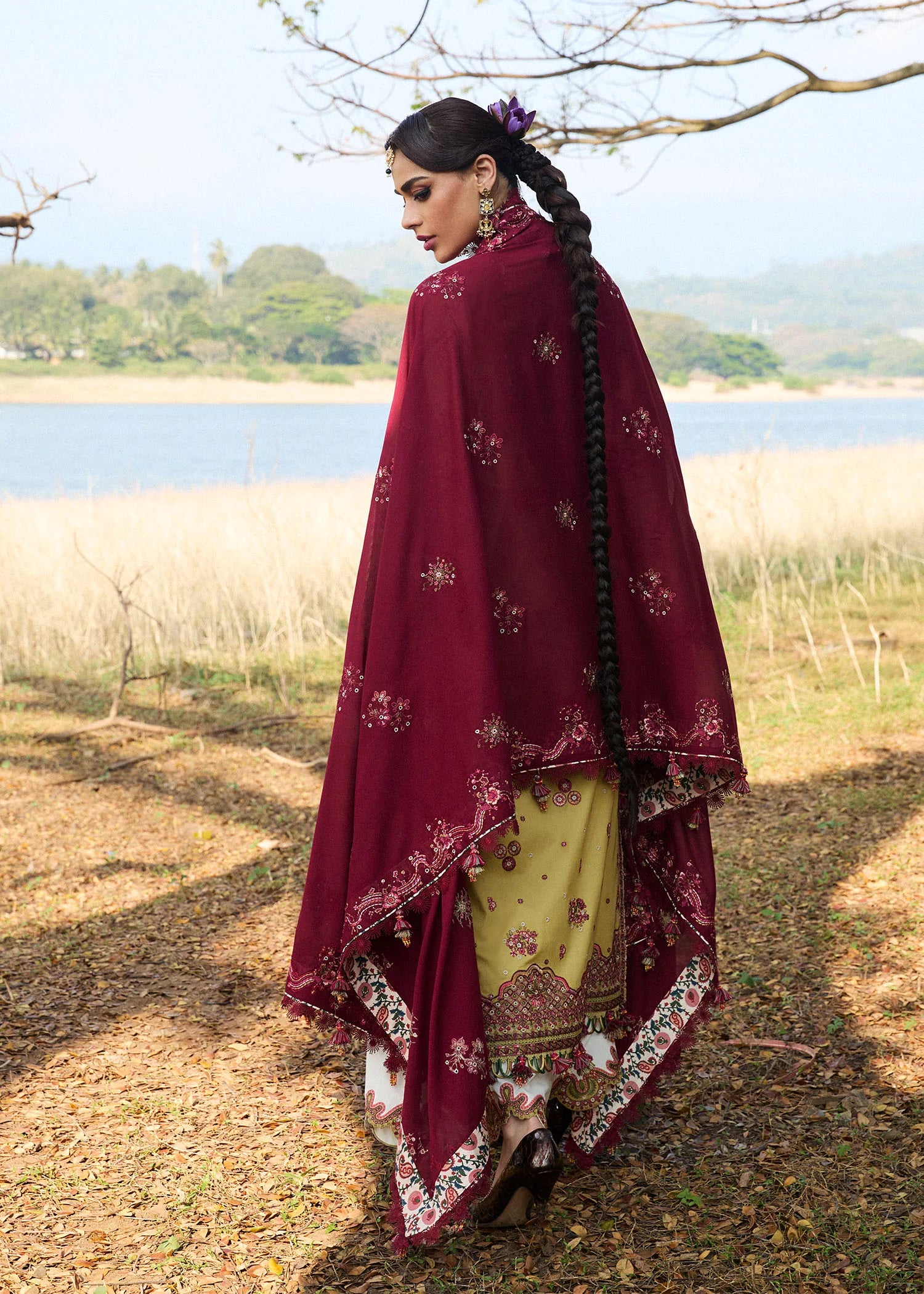 Model wearing Hussain Rehar Luxury Lawn '25 Minted in mustard with maroon embroidery. Shop Pakistani luxury pret online in the UK.